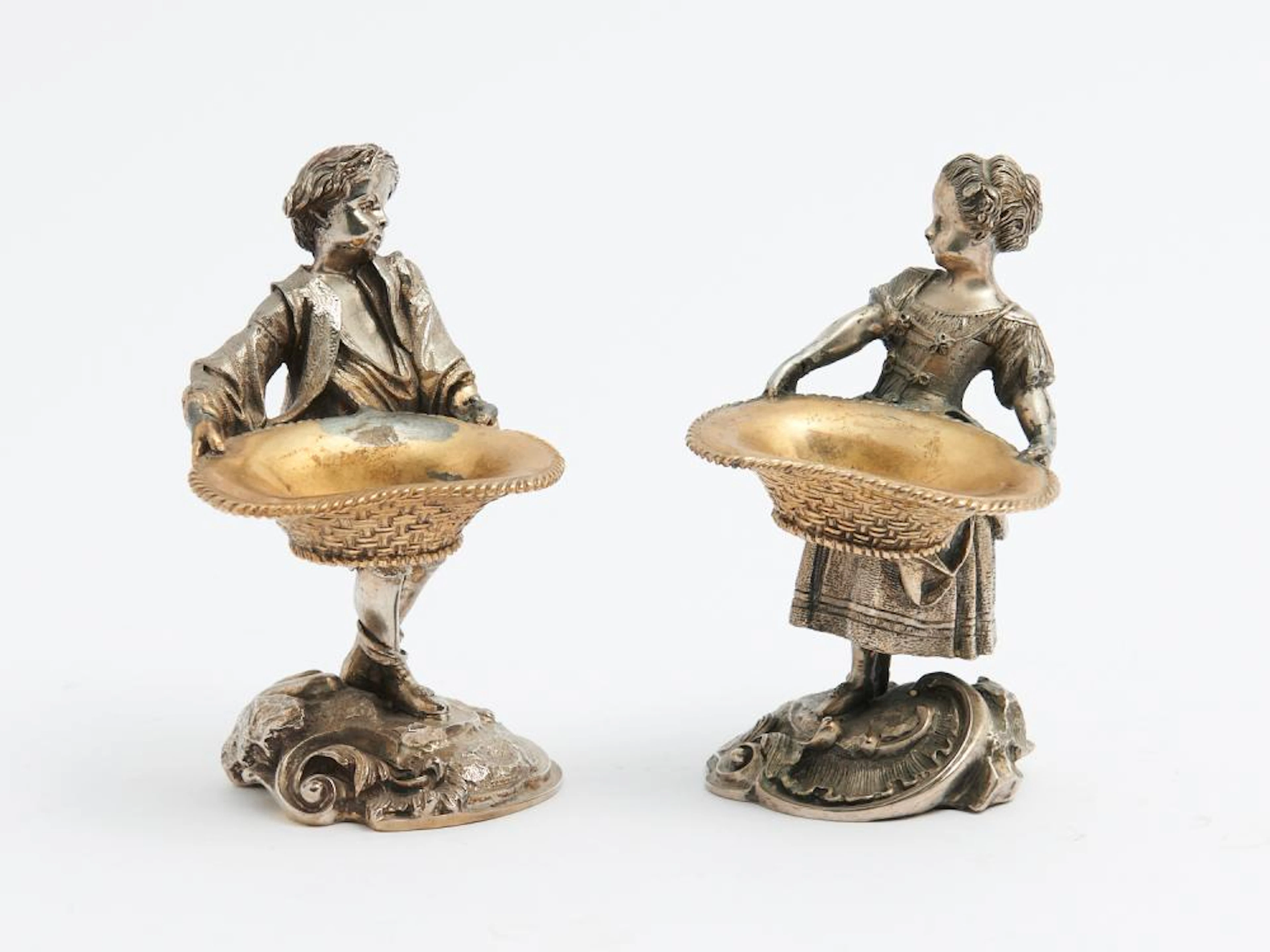 A PAIR OF FRENCH FIGURAL SILVER PLATE TABLE SALTS WITH...