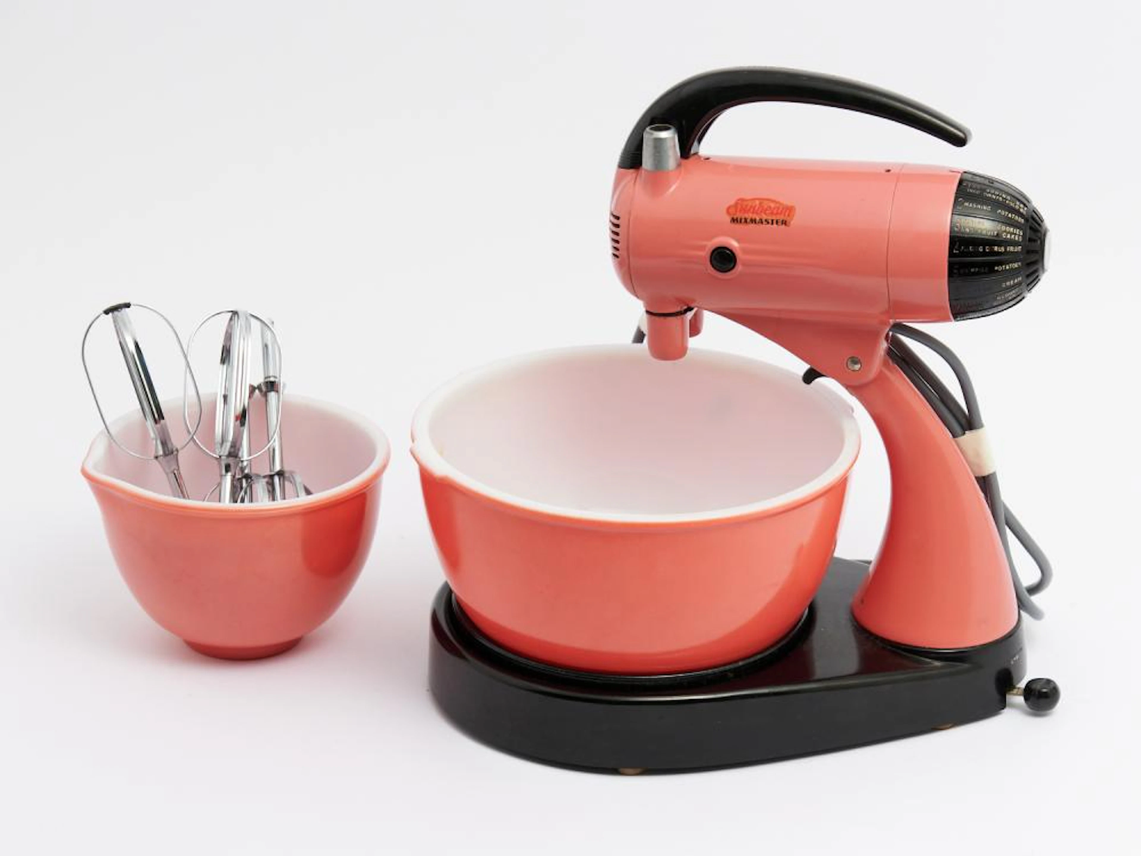 A VINTAGE FLAMINGO PINK SUNBEAM MIXMASTER WITH TWO BOWLS...