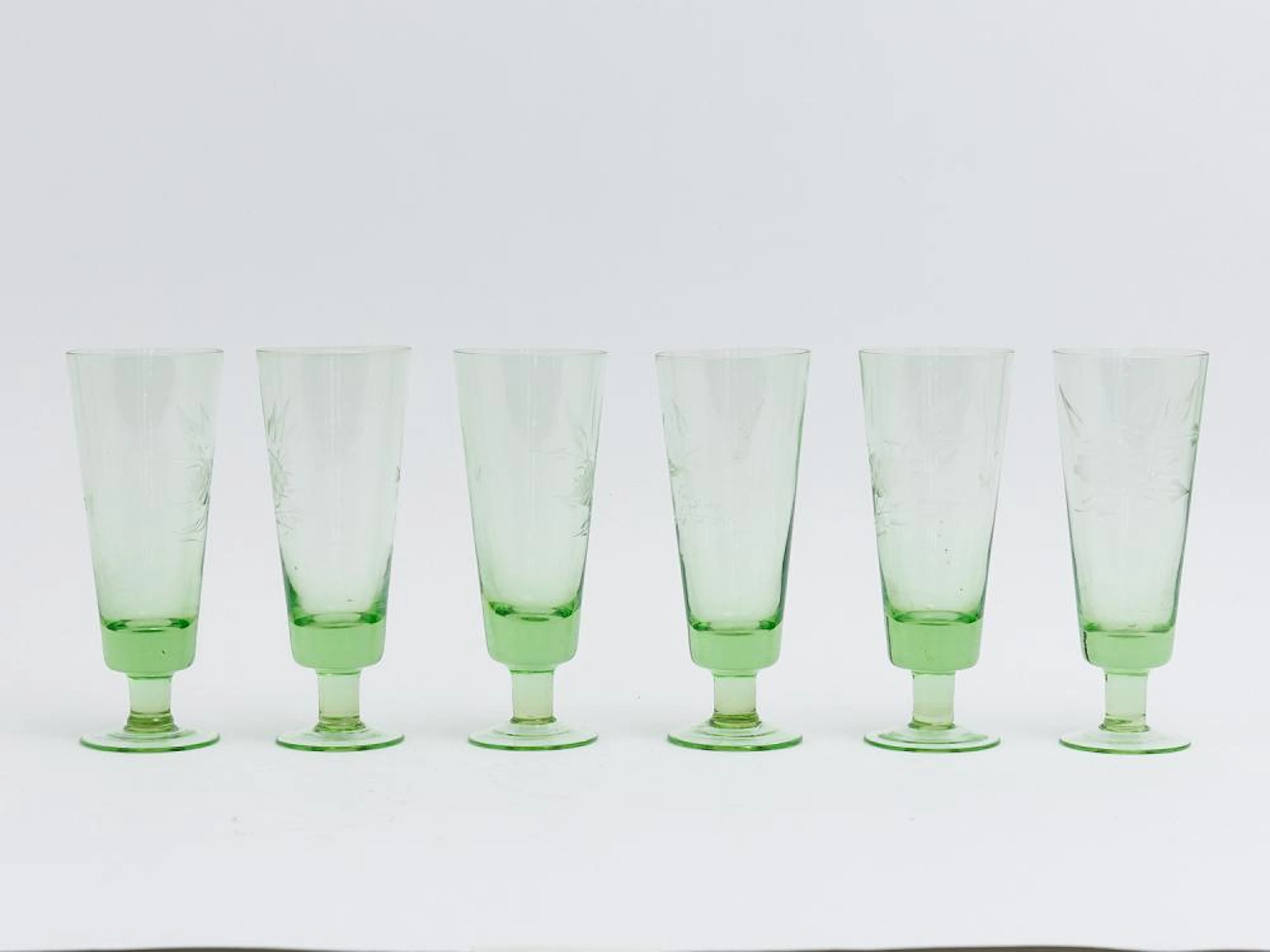 A SET OF SIX DEPRESSION GLASS FLUTES