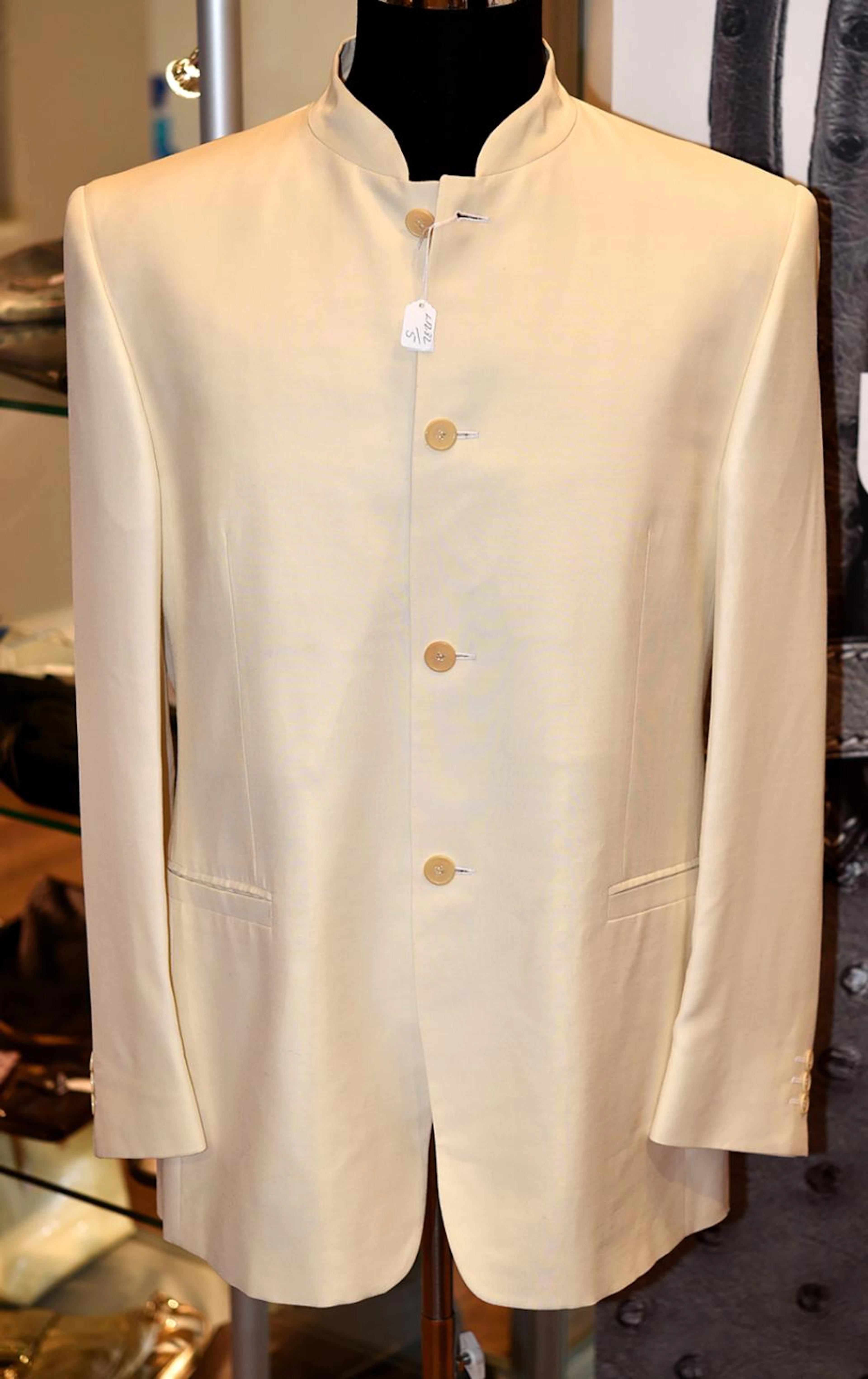 A GENTLEMAN'S SUIT BY VERSACE - Styled in a cream...