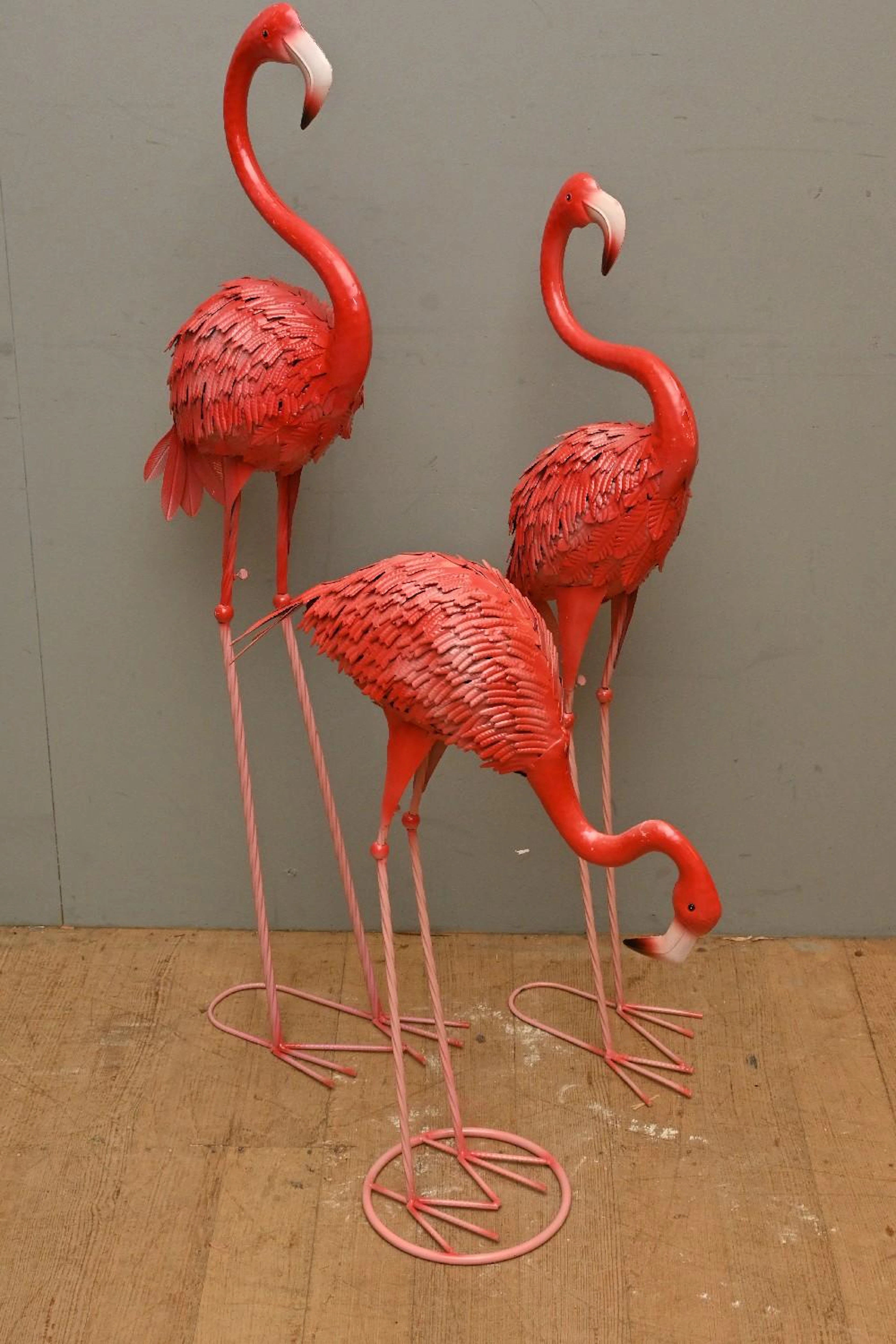 A SET OF THREE METAL FLAMINGO FIGURES (120H CM) (LEONARD...