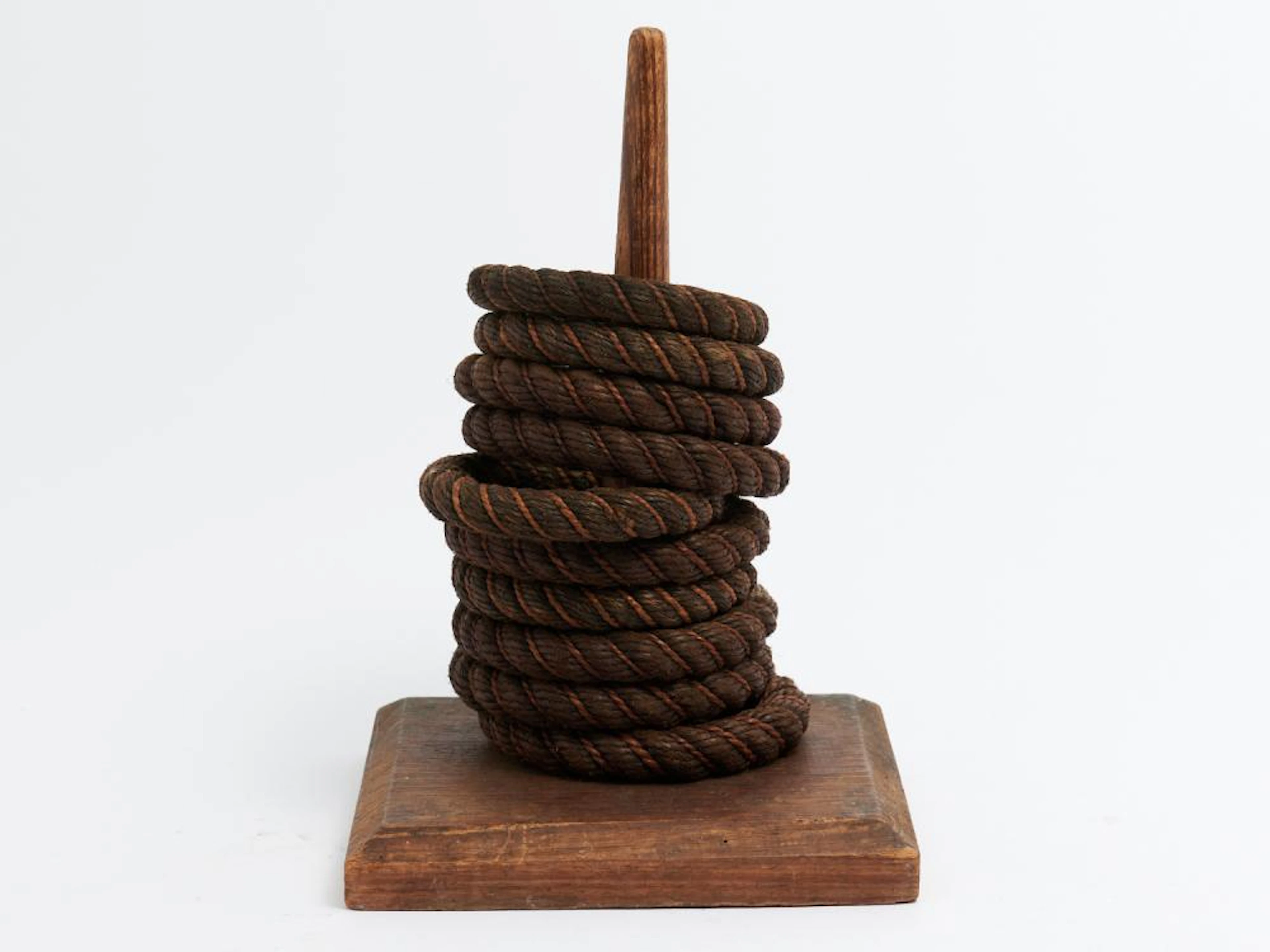 A VINTAGE OAK QUOITES SET OF TEN RINGS H.34CM
