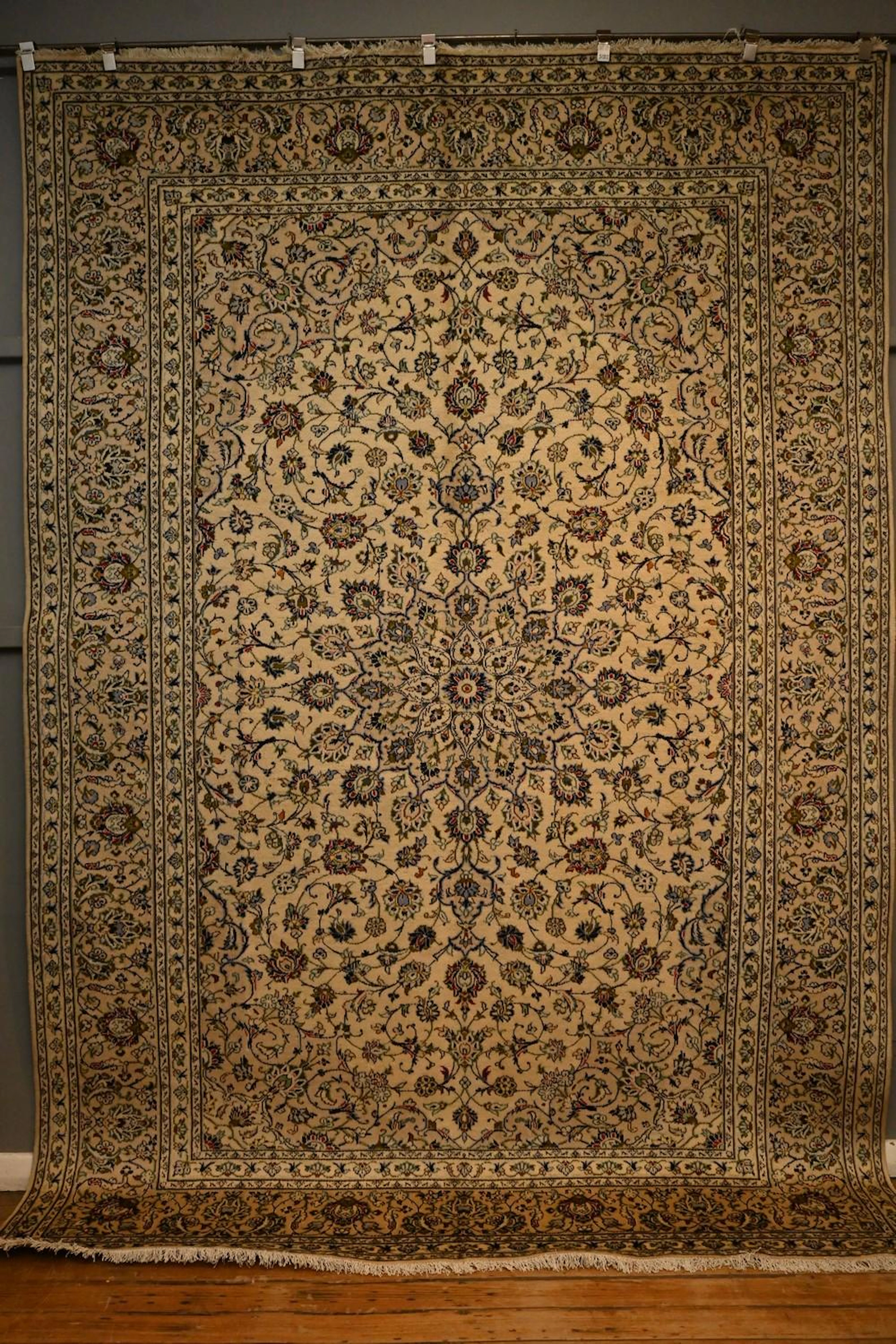 A LARGE AND TRADITIONAL PERSIAN KASHAN CARPET