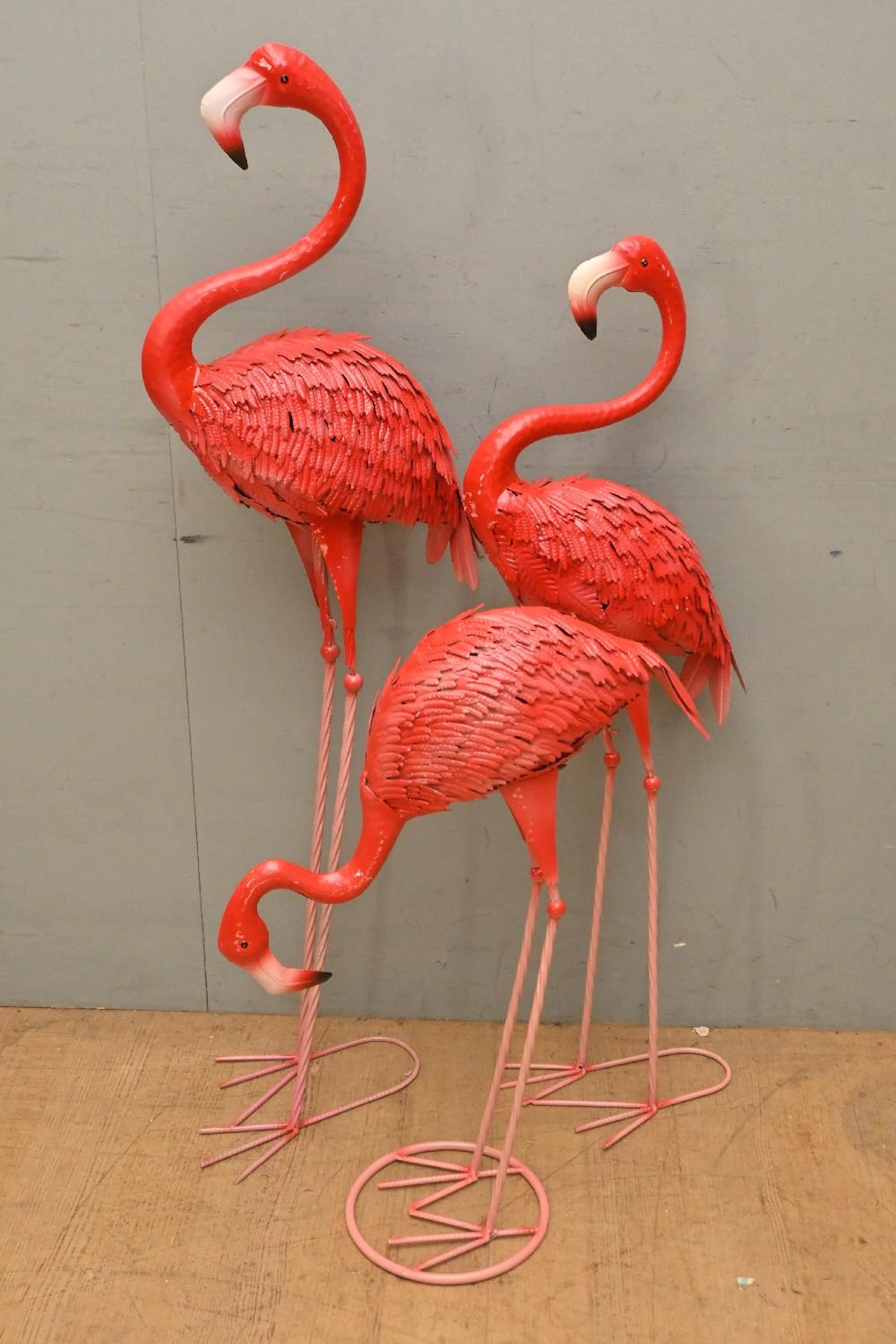 A COLLECTION OF THREE CAST IRON GARDEN FLAMINGOES (120H...