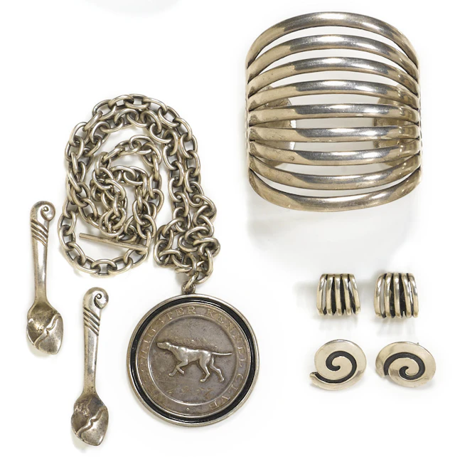 A group of Navajo White Hogan jewelry items
