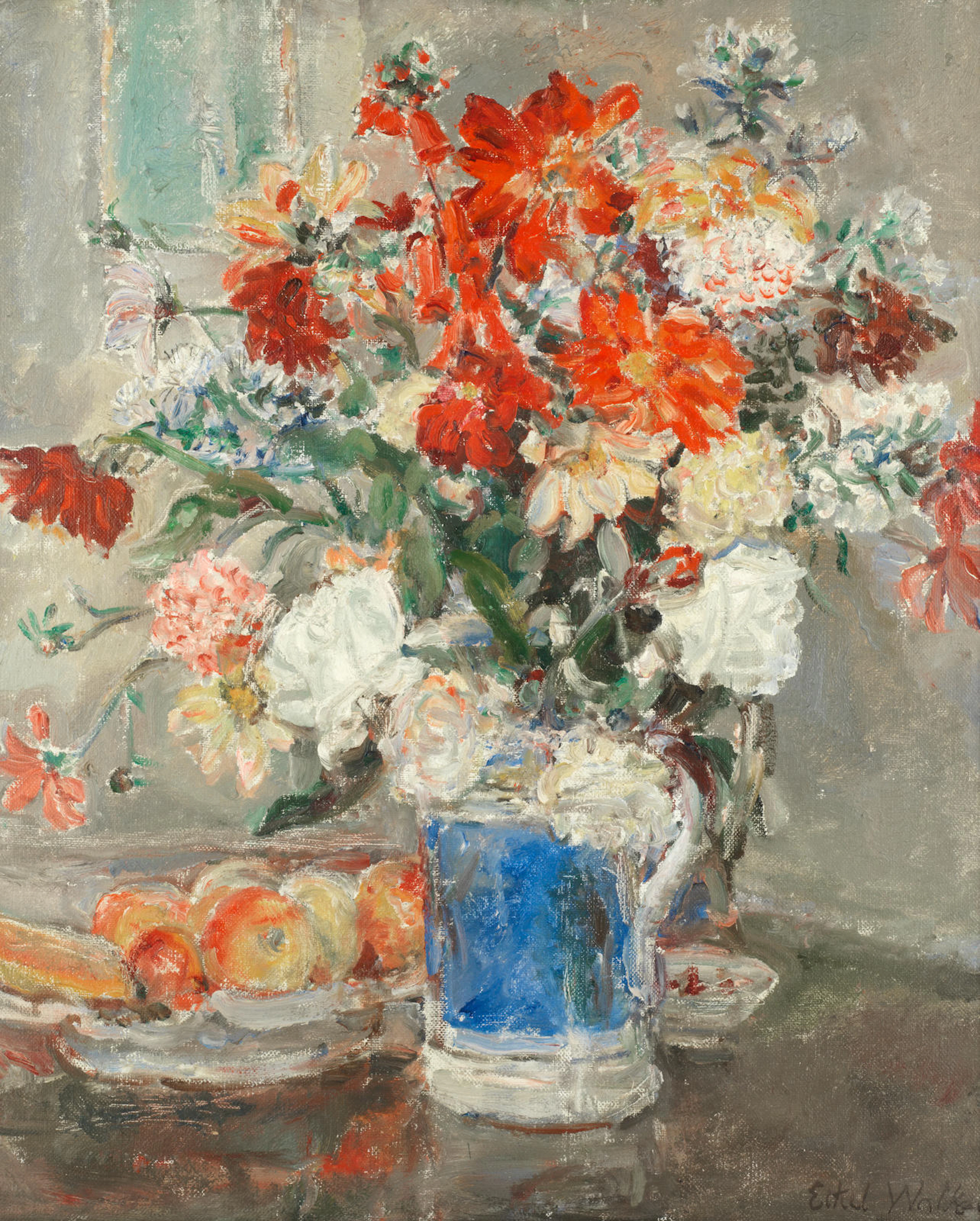 Still life of mixed flowers in a blue vase