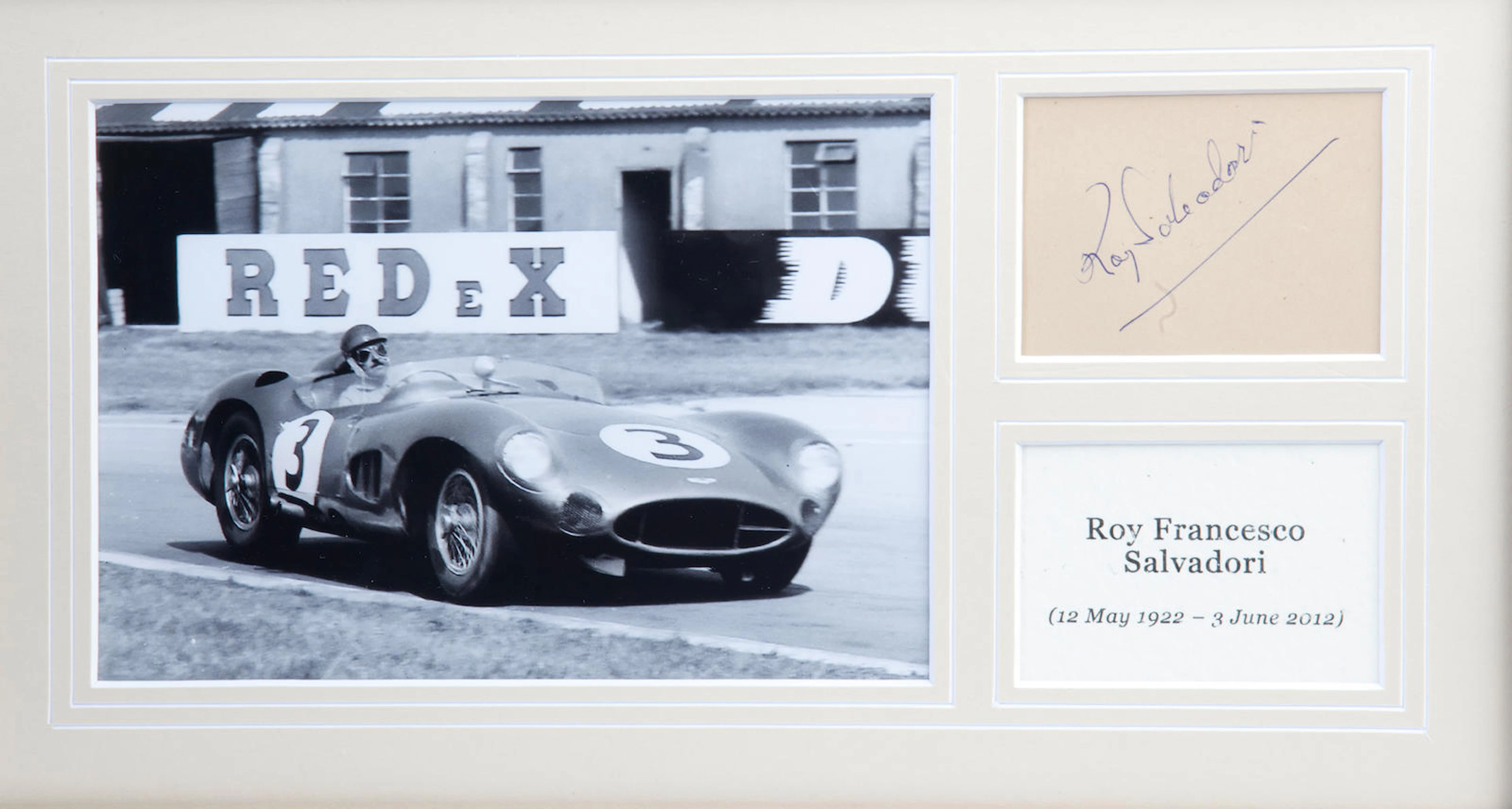 A Roy Salvadori Aston Martin DBR1 framed display with signature,
