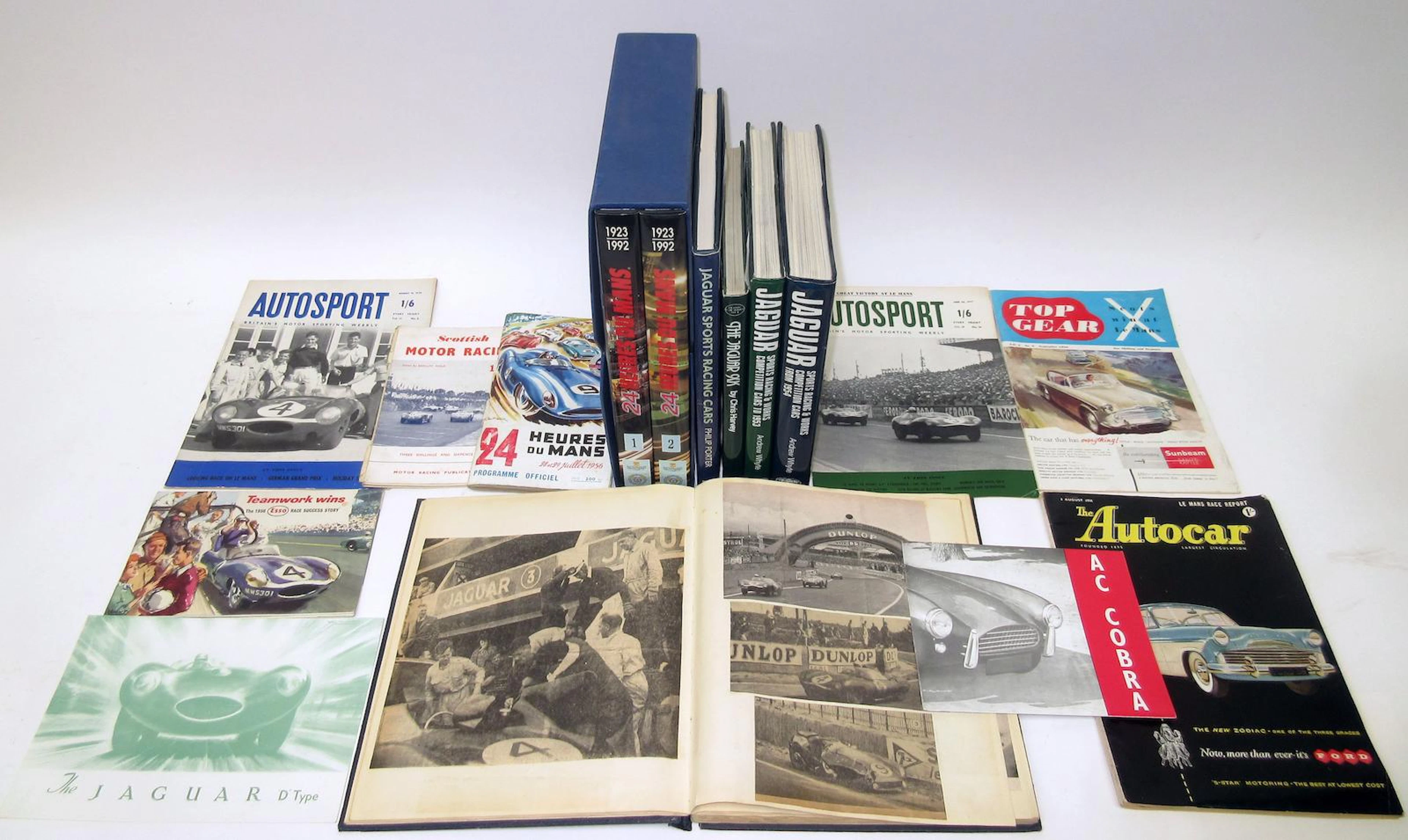 A collection of books and ephemera relating to Ecurie Ecosse, Le Mans and Jaguar,