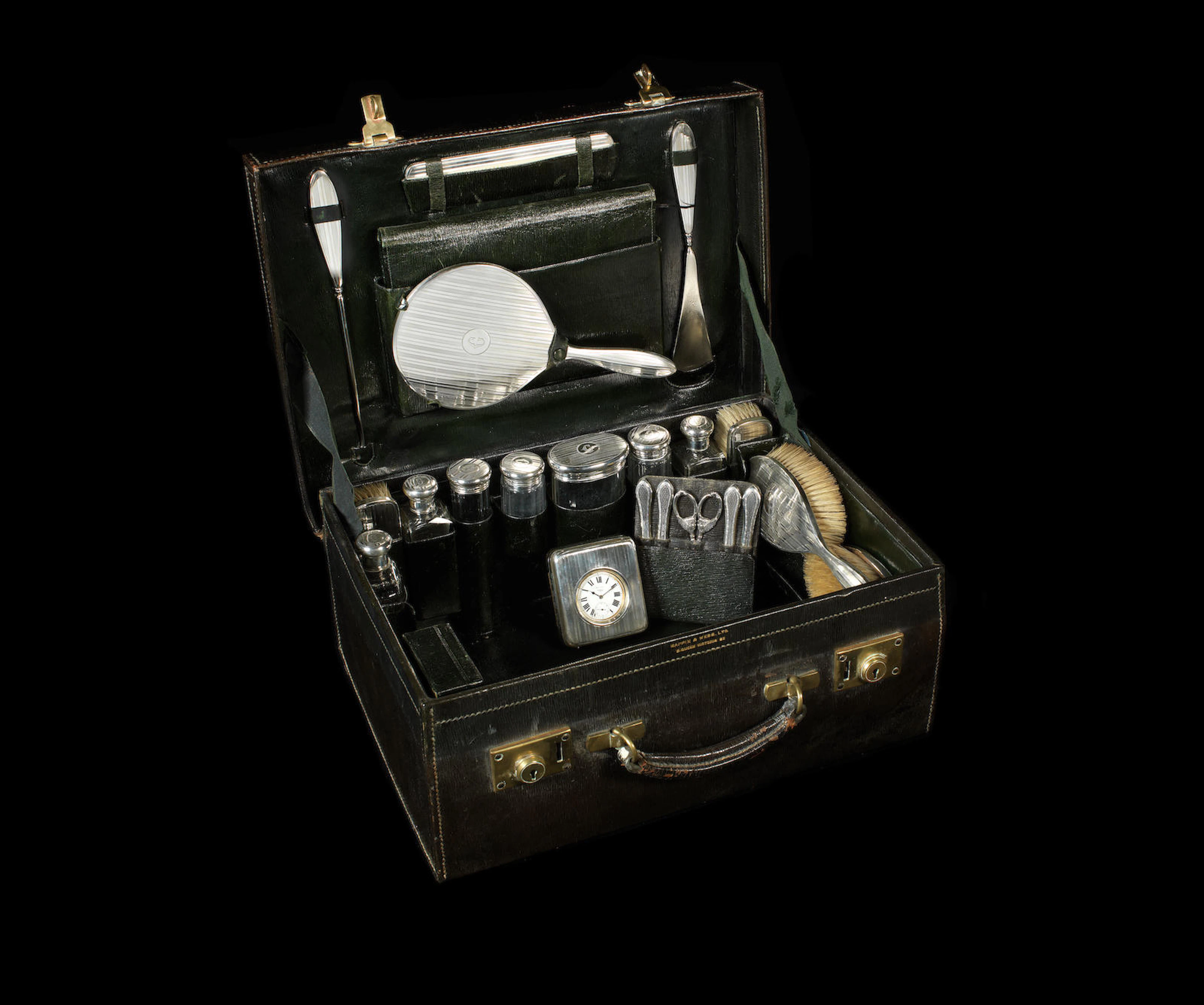 A fine leather-cased gentleman's vanity set with sterling silver accessories, by Mappin & Webb, 1919,