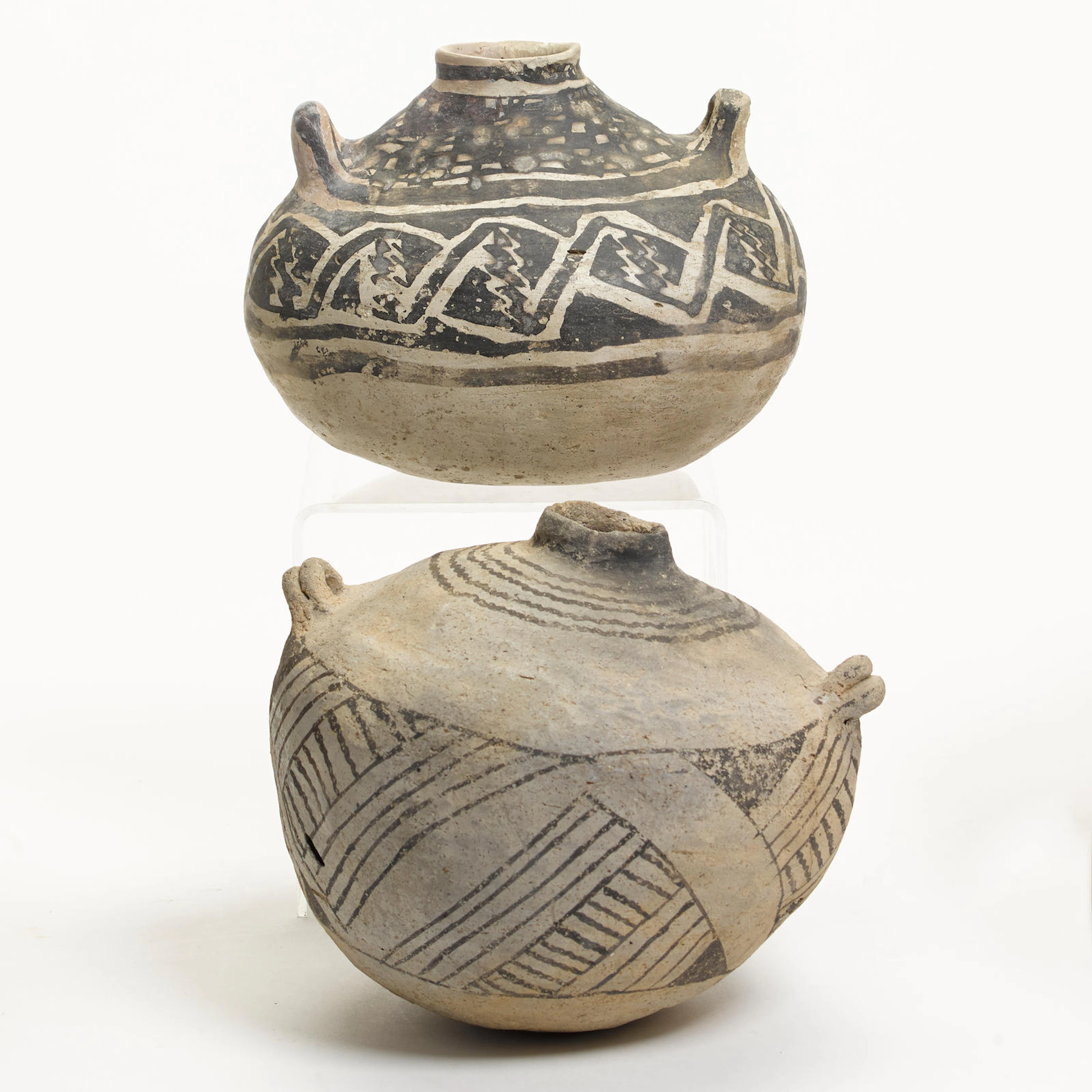Two Anasazi black-on-white canteens