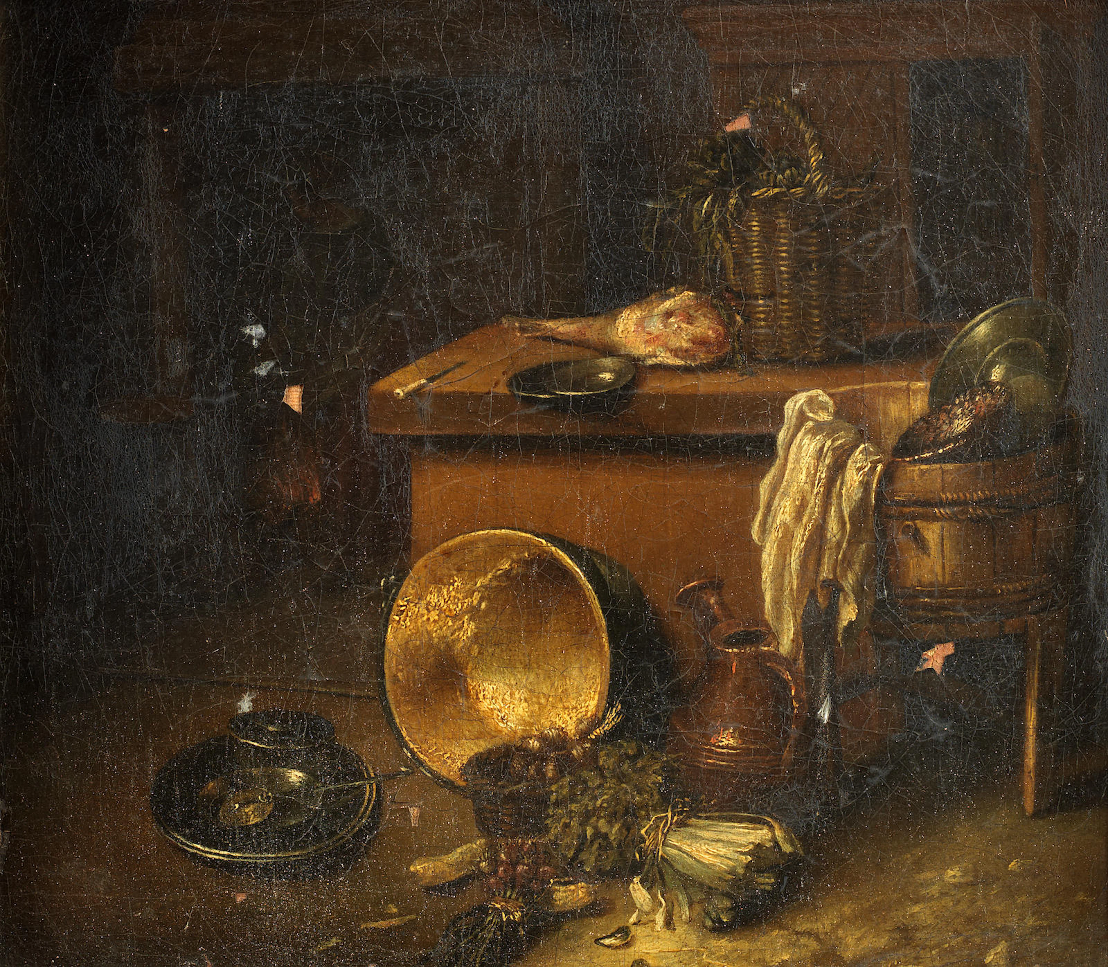 A kitchen still life with bundle of radishes, kale, a knuckle of pork, brass and wooden kitchenware, trunk and open cupboard