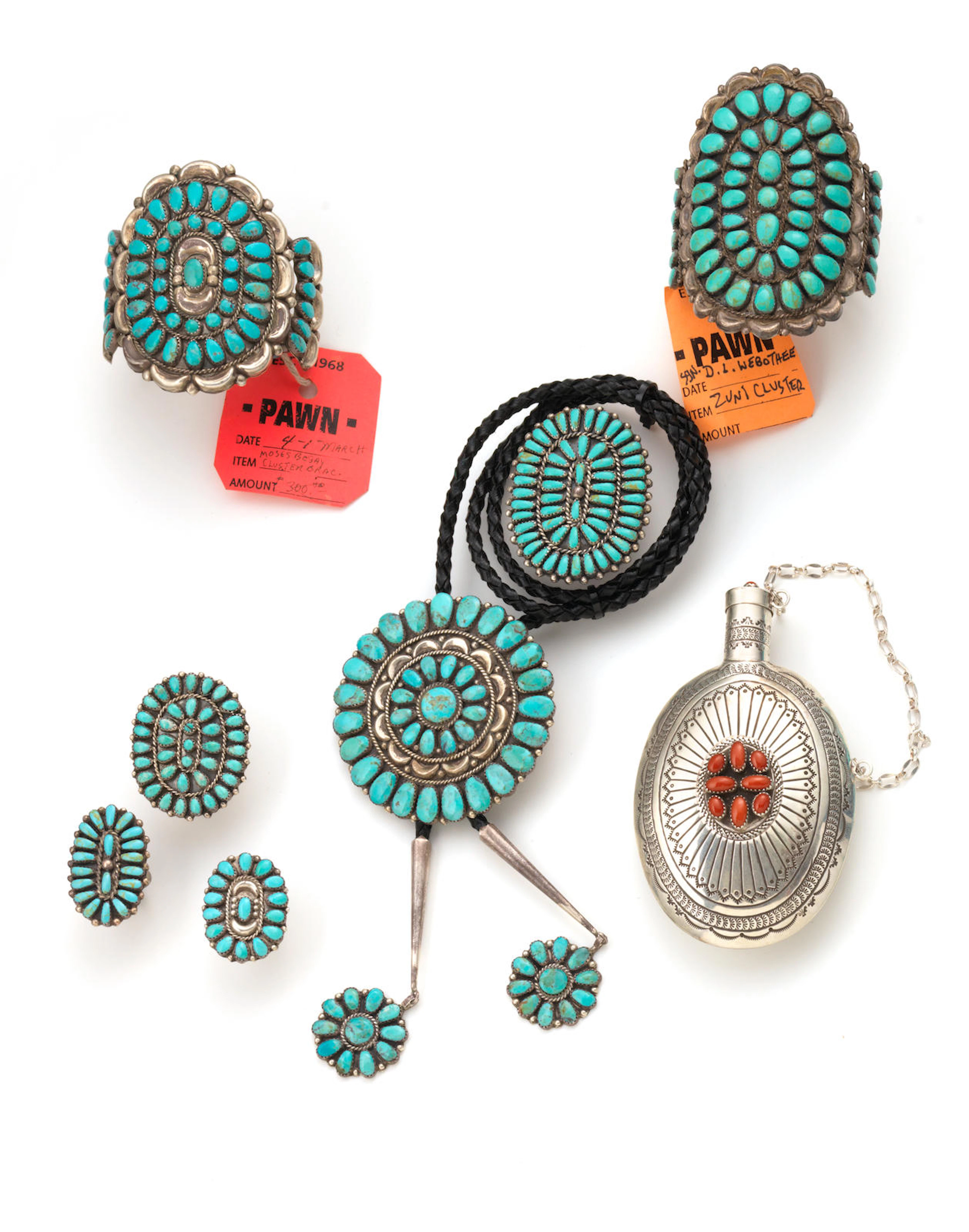 Seven Zuni or Navajo jewelry items and a Southwest tobacco canteen