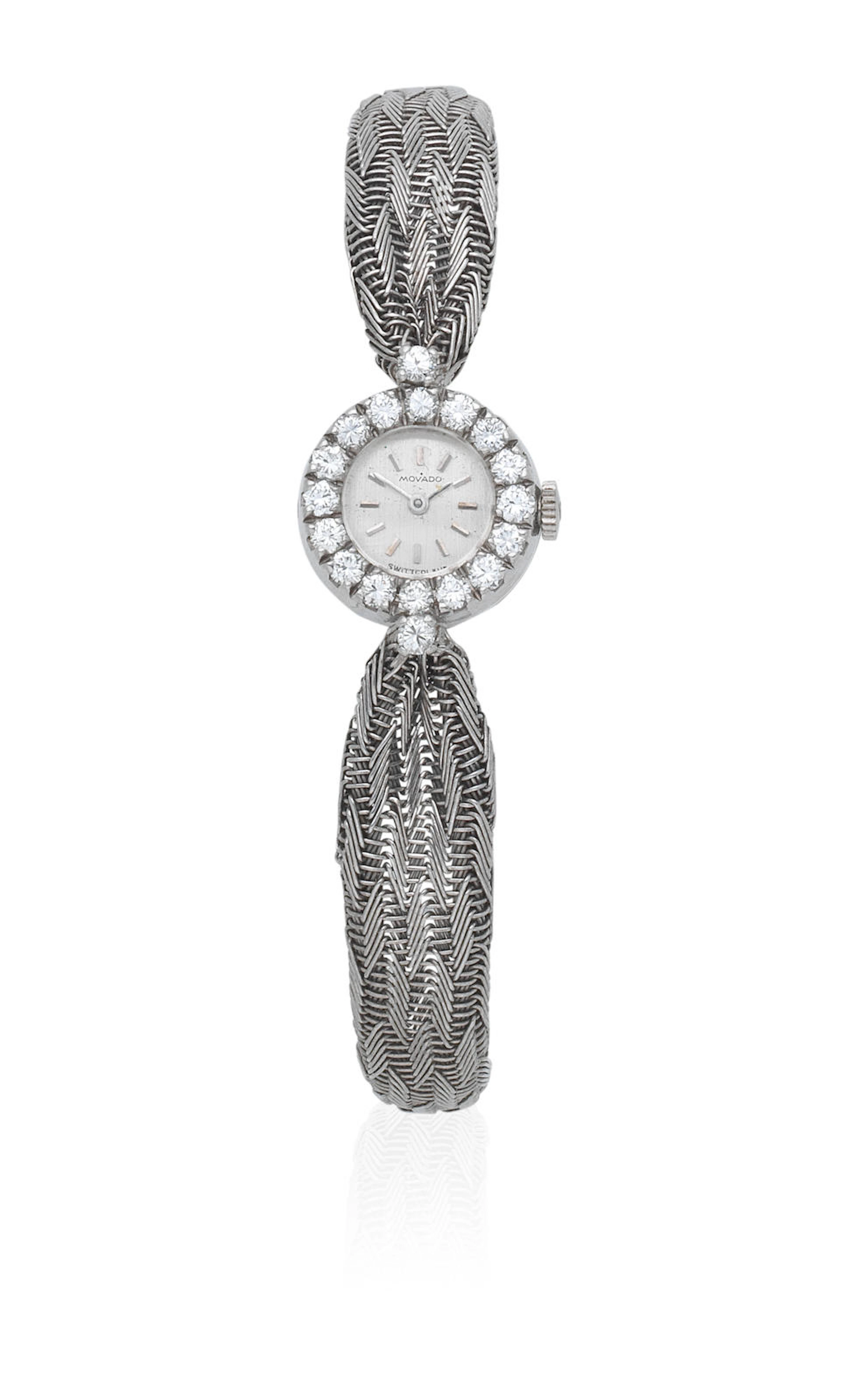 Movado. A lady's 18K and 14K white gold manual wind diamond set cocktail bracelet watch Circa 1950
