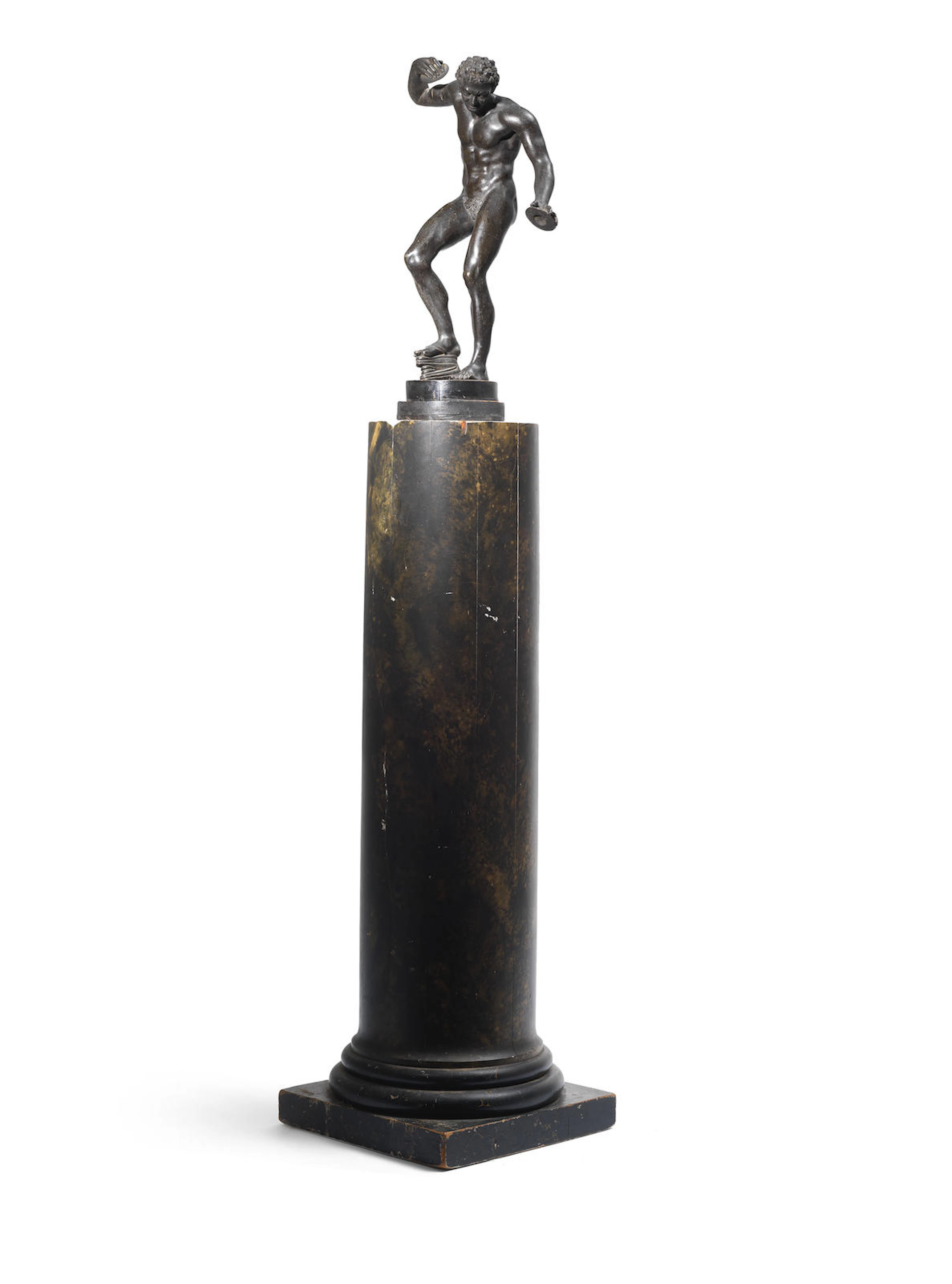 After the antique: A late 19th century Italian patinated bronze figure of The Dancing Faun with Cymbals on a contemporary faux marble painted wood