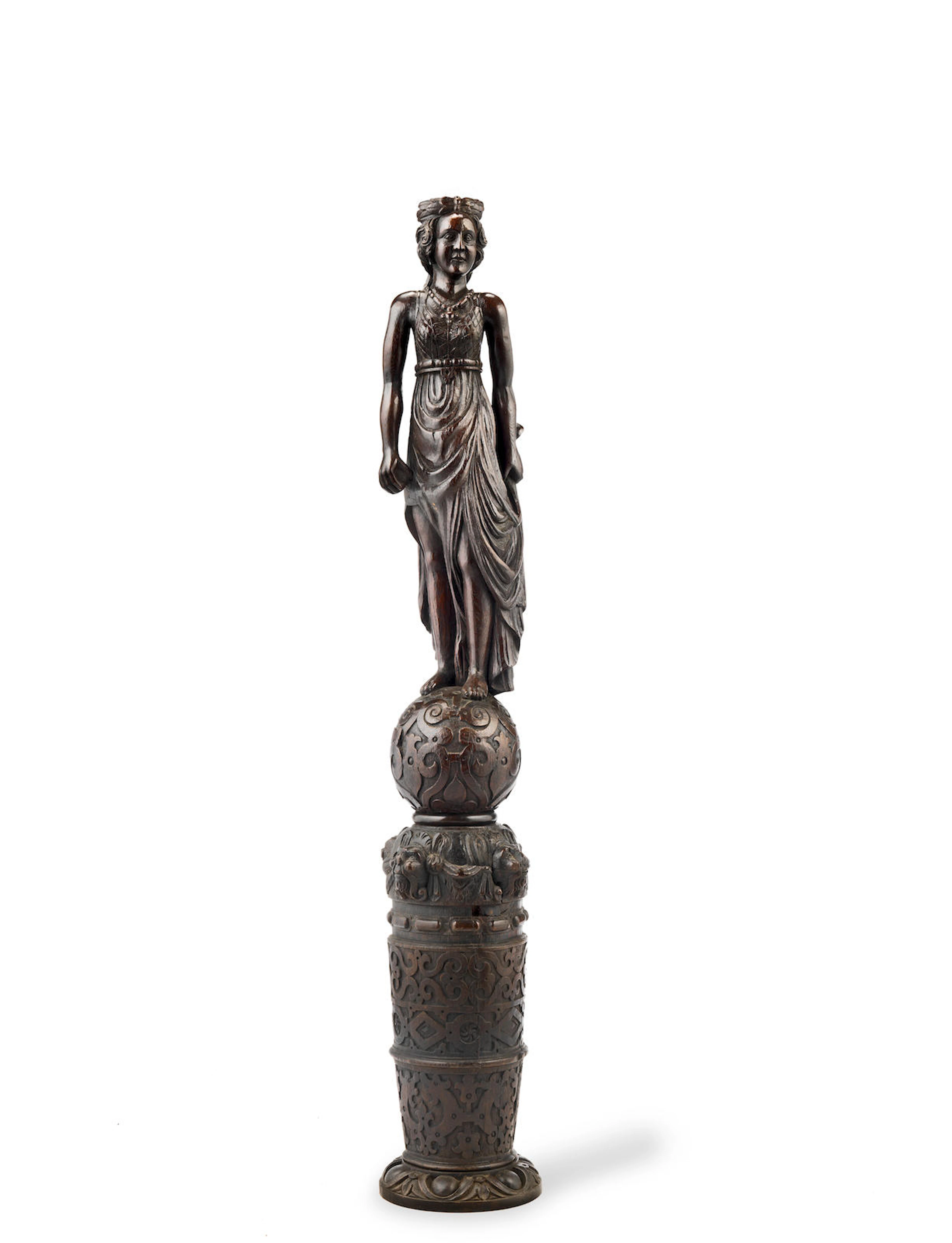 A fine Elizbeth I/James I carved oak newel finial, circa 1600, mounted on an associated Elizabeth I/James I carved oak bed-post section, circa 1600