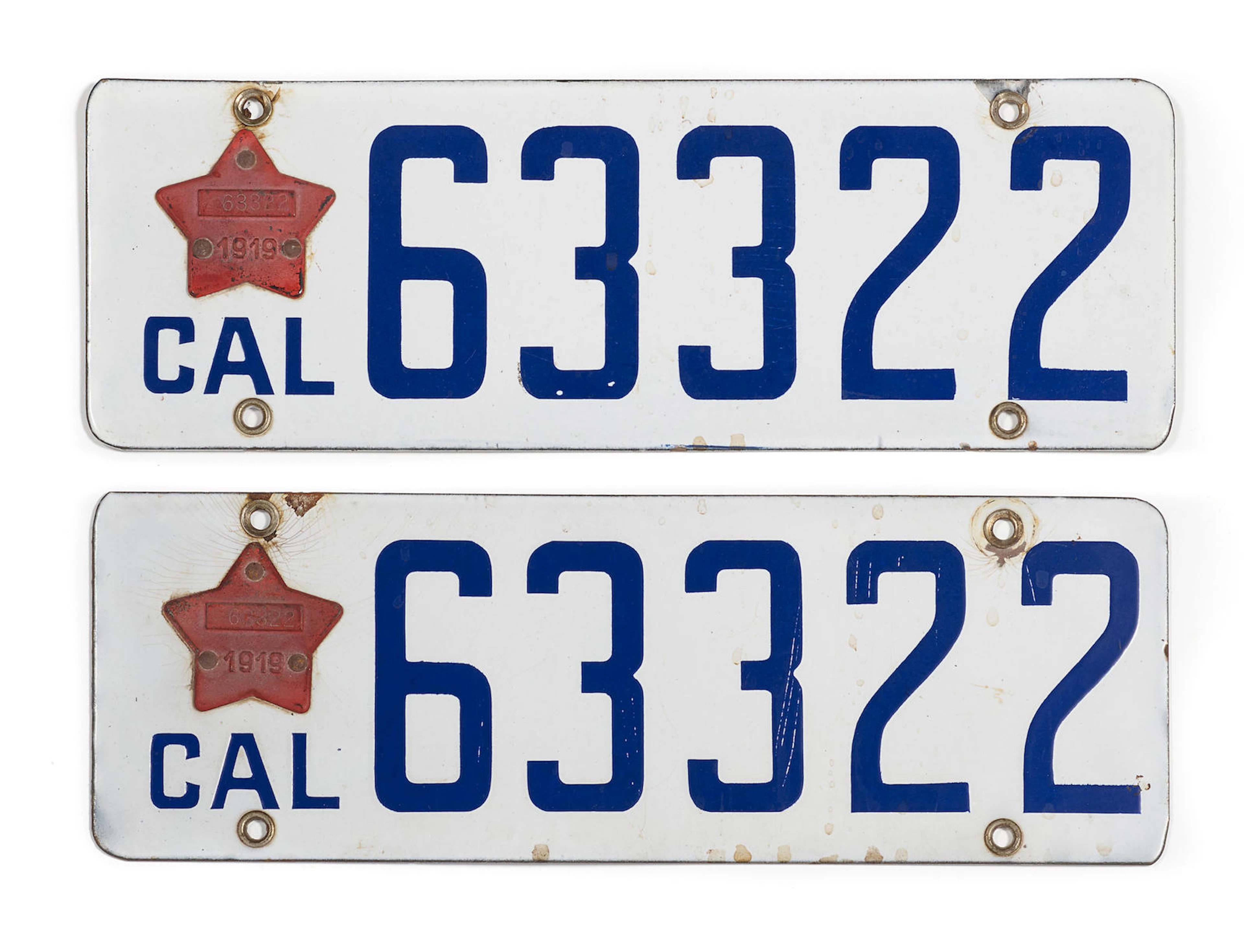 A pair of California licence plates, with 1919 star shaped tags,