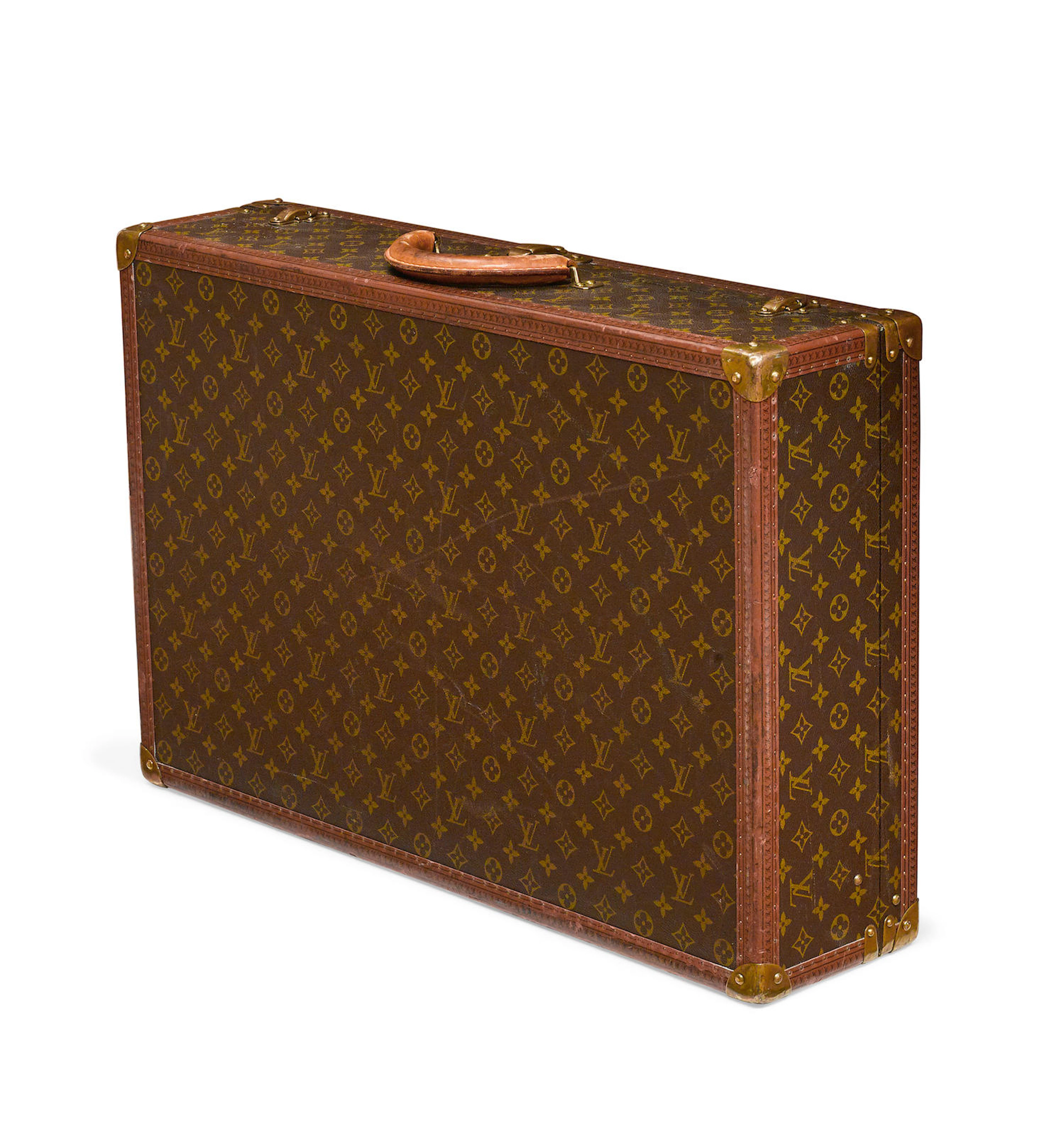 A Louis Vuitton Alzer hard sided suitcase numbered 984151 circa 1980