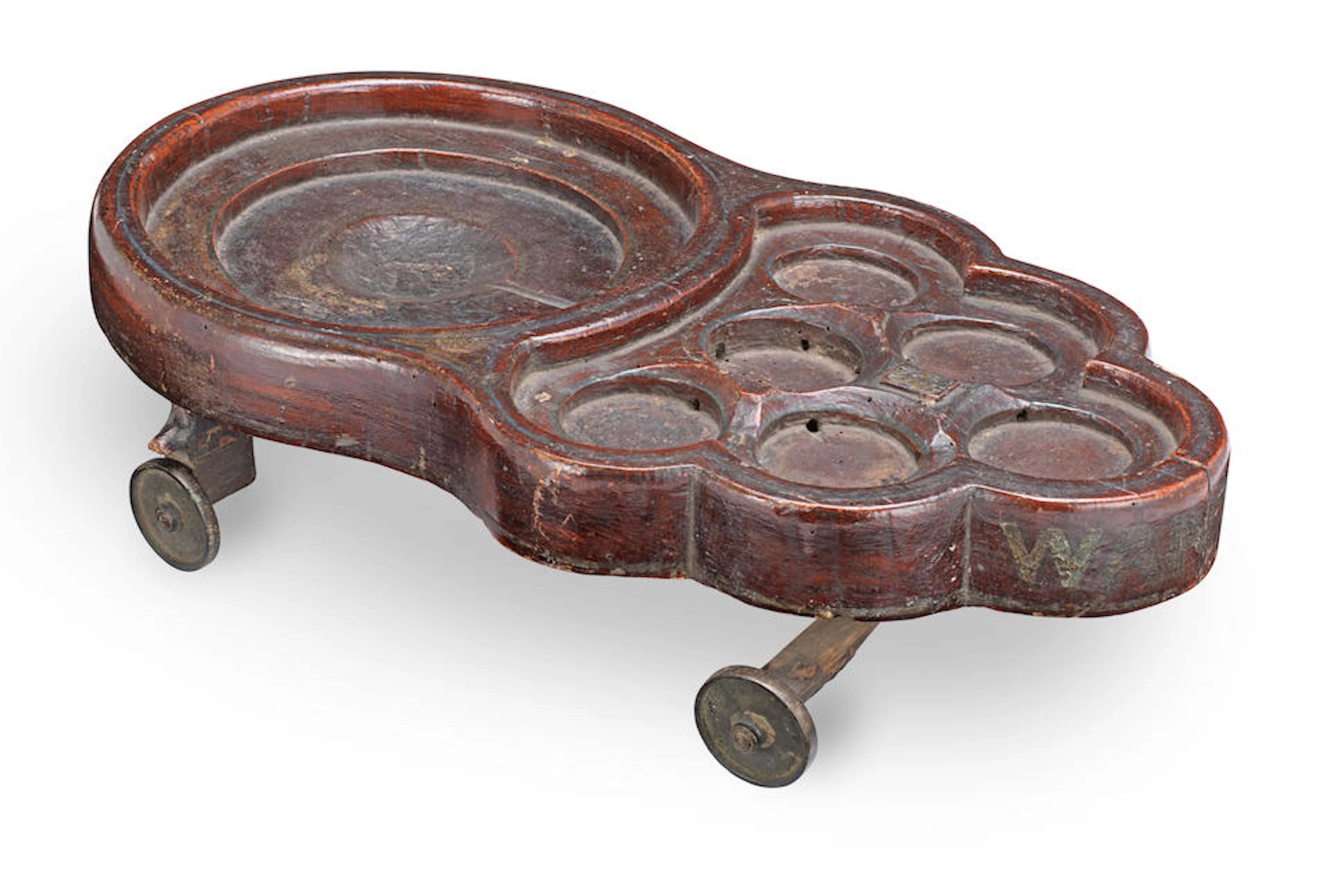 A 19th century stained and painted beer coaster, English
