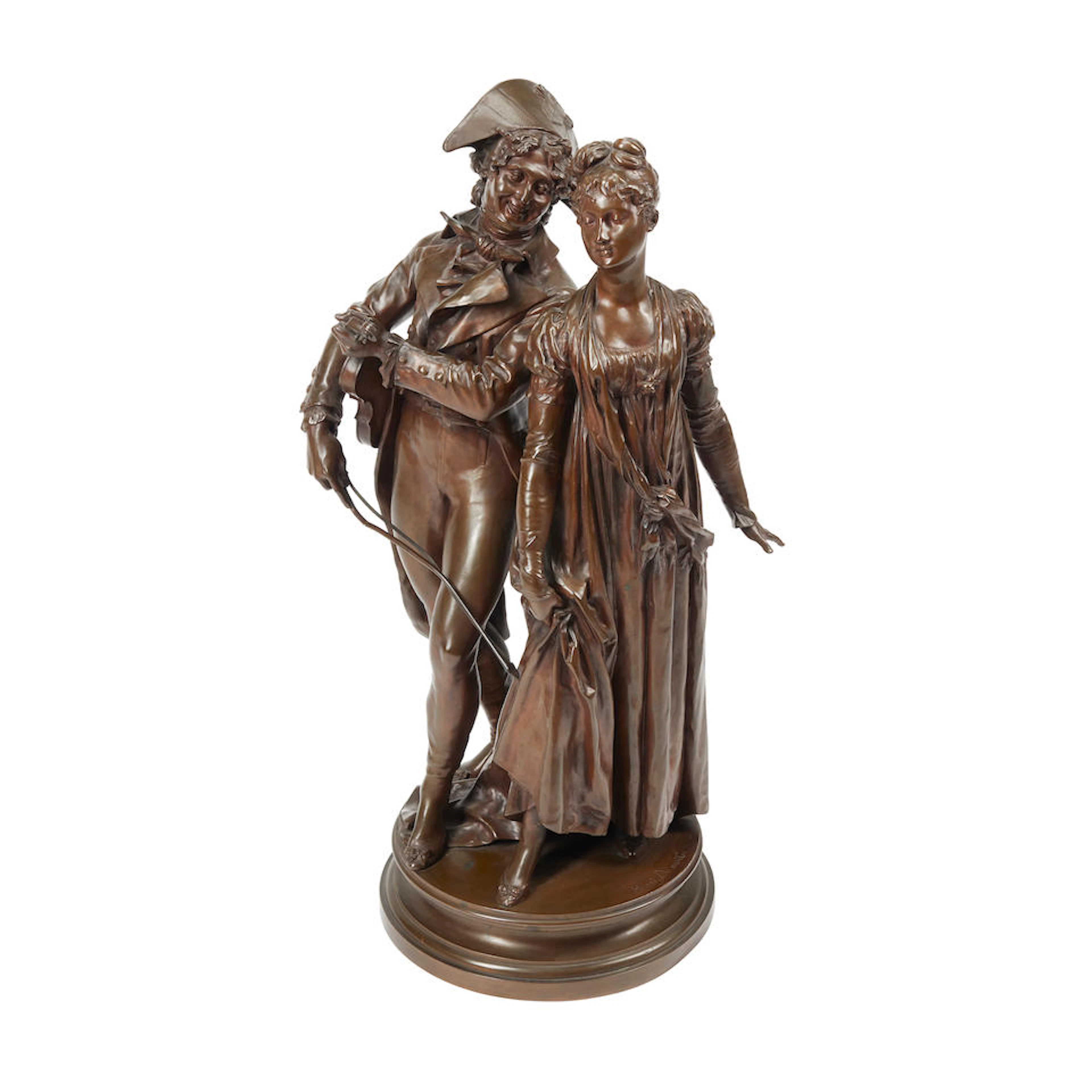 A patinated bronze figural group of an amorous couple...