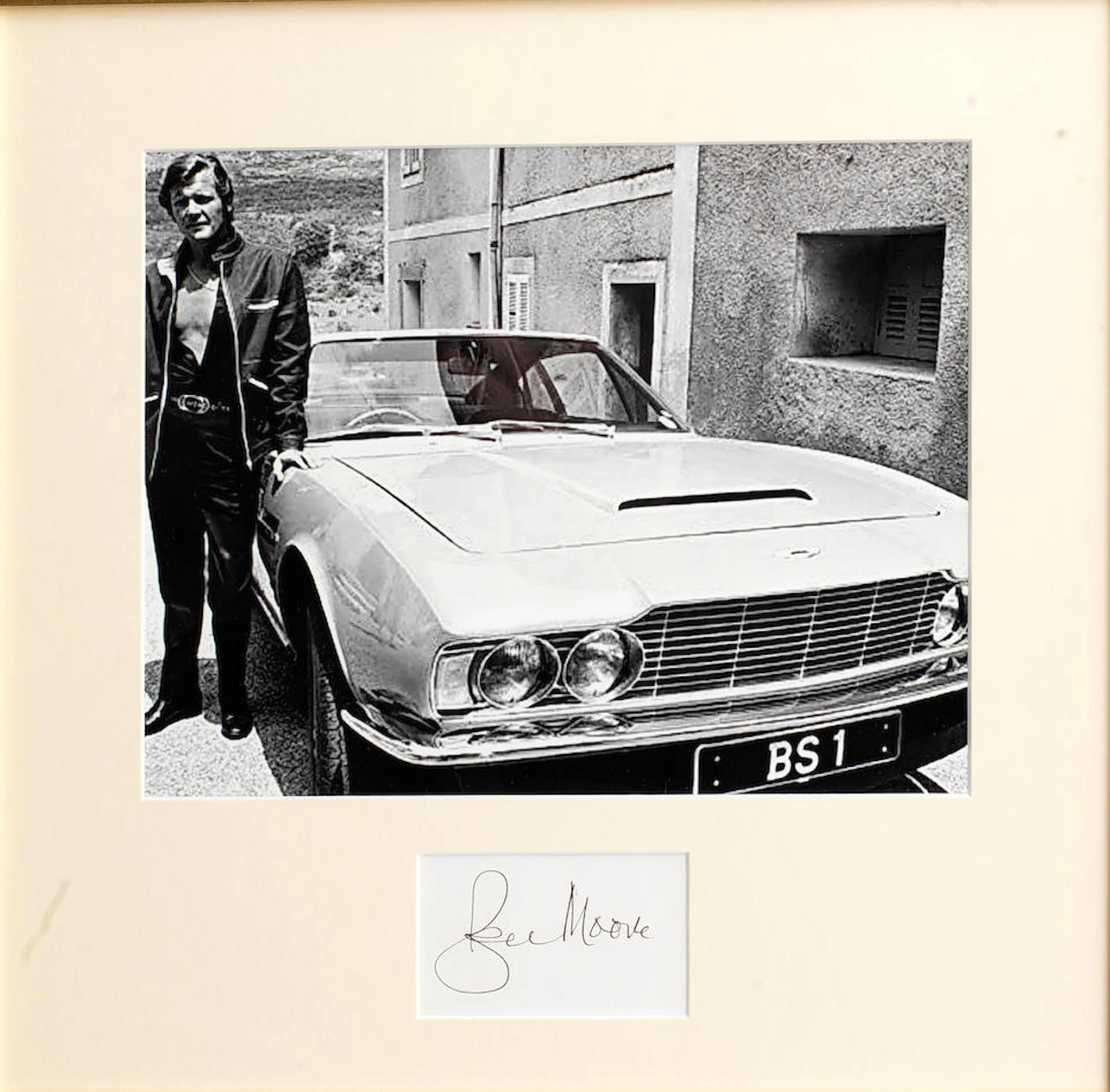 A Persuaders image, mounted with a Roger Moore signature,,