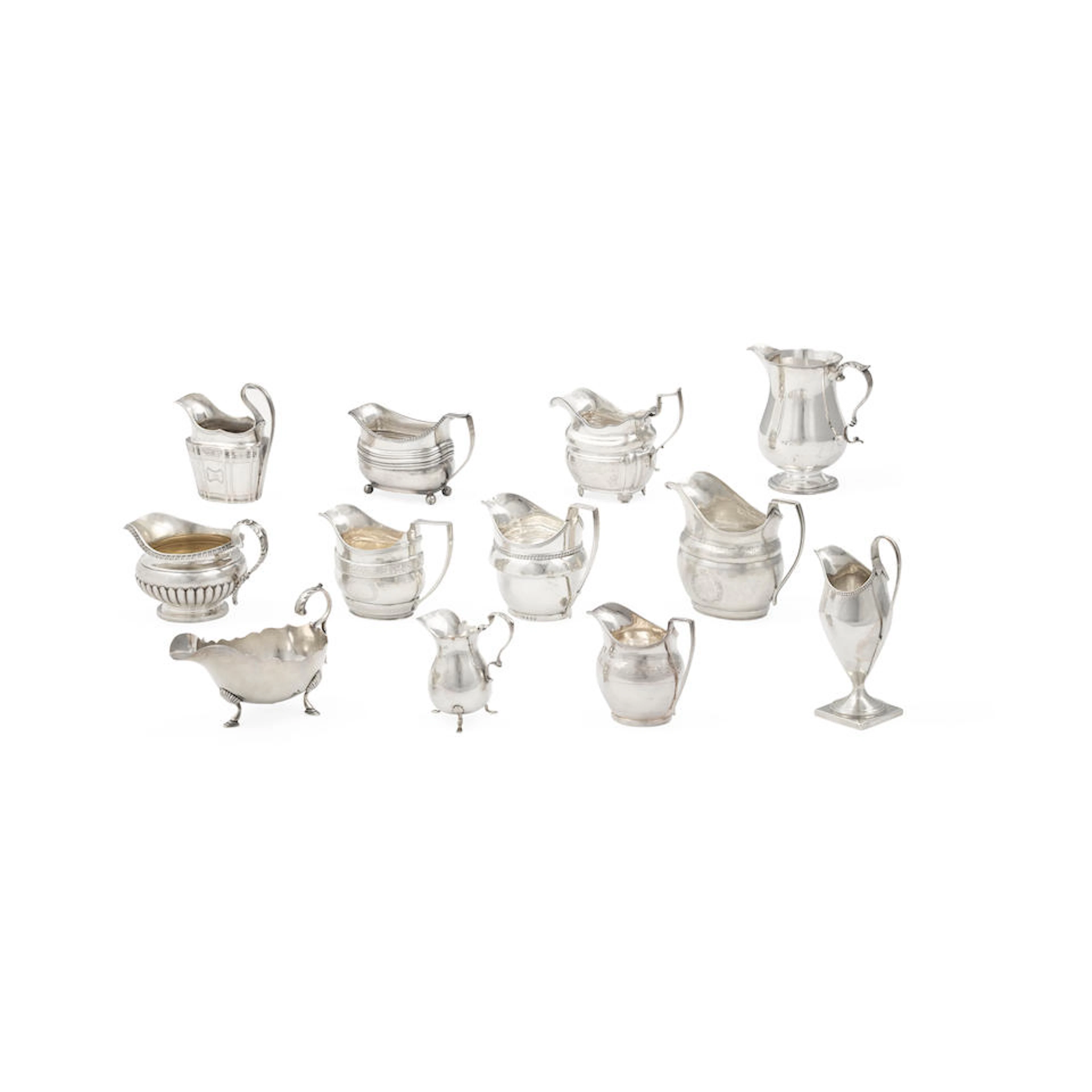 A GROUP OF TWELVE ENGLISH SILVER CREAMERS AND SMALL SAUCE...