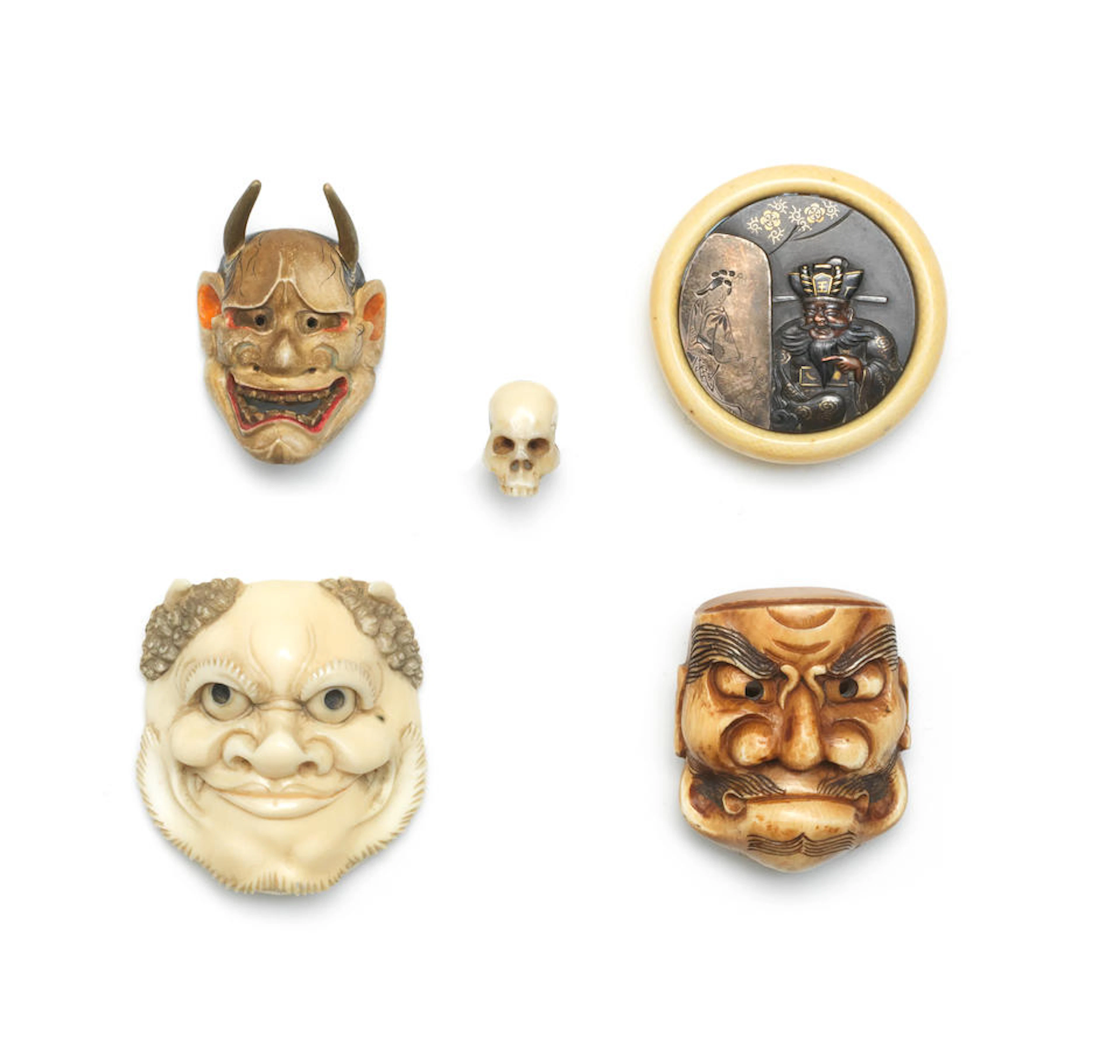 Four various netsuke and an ivory cord fastener One by...