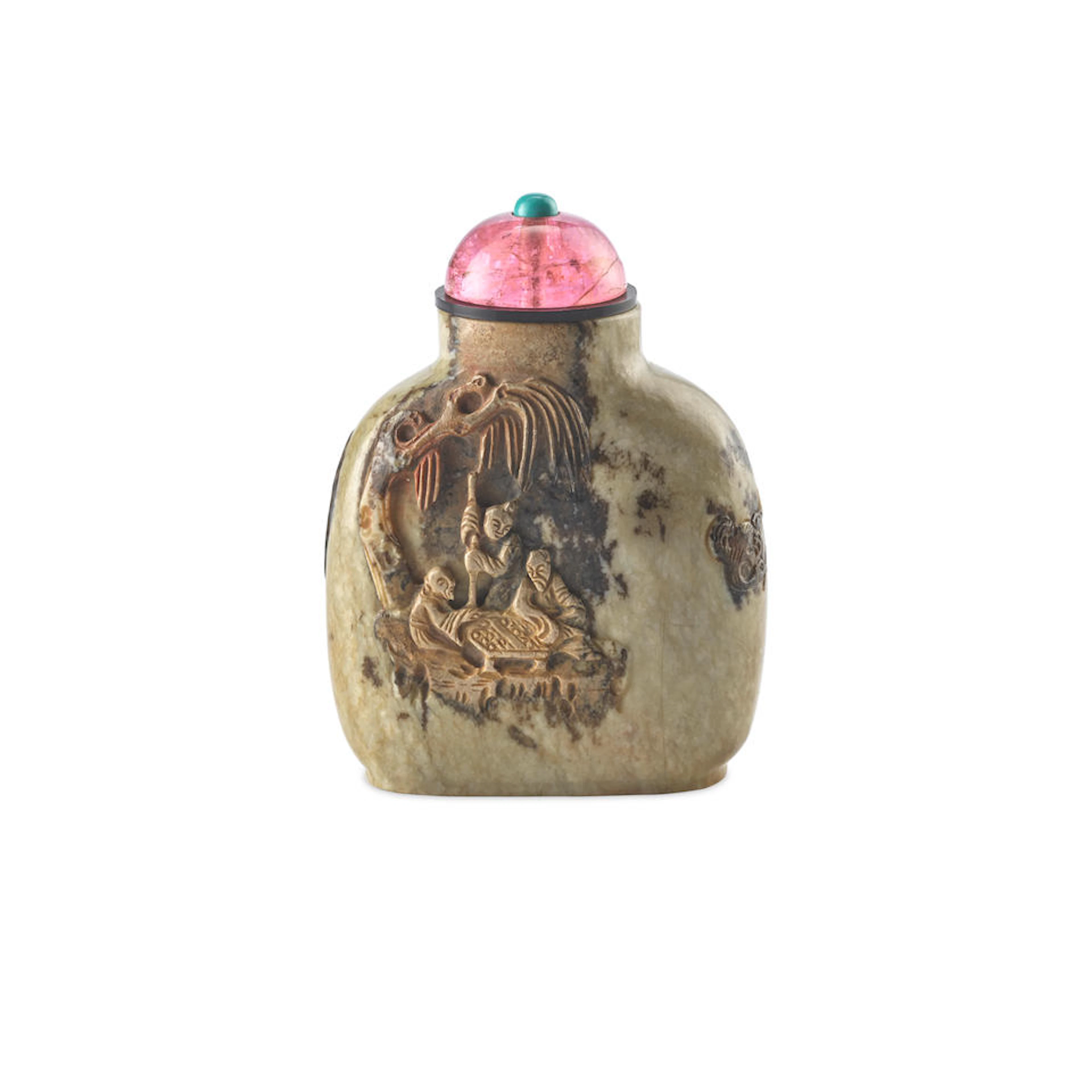 A Large carved russet and beige jade snuff bottle Master of the Rocks School