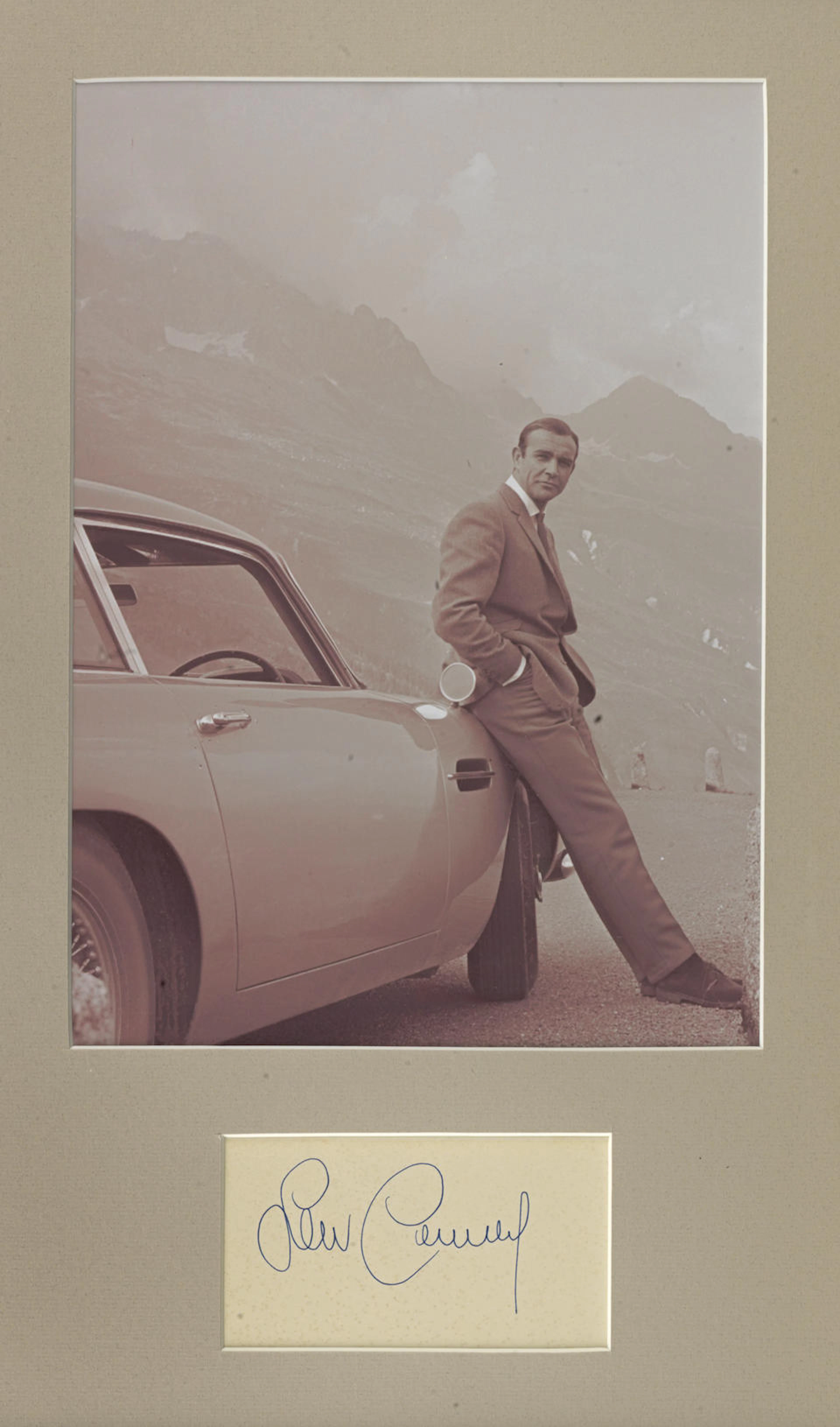 A photograph with signature of Sean Connery with the...