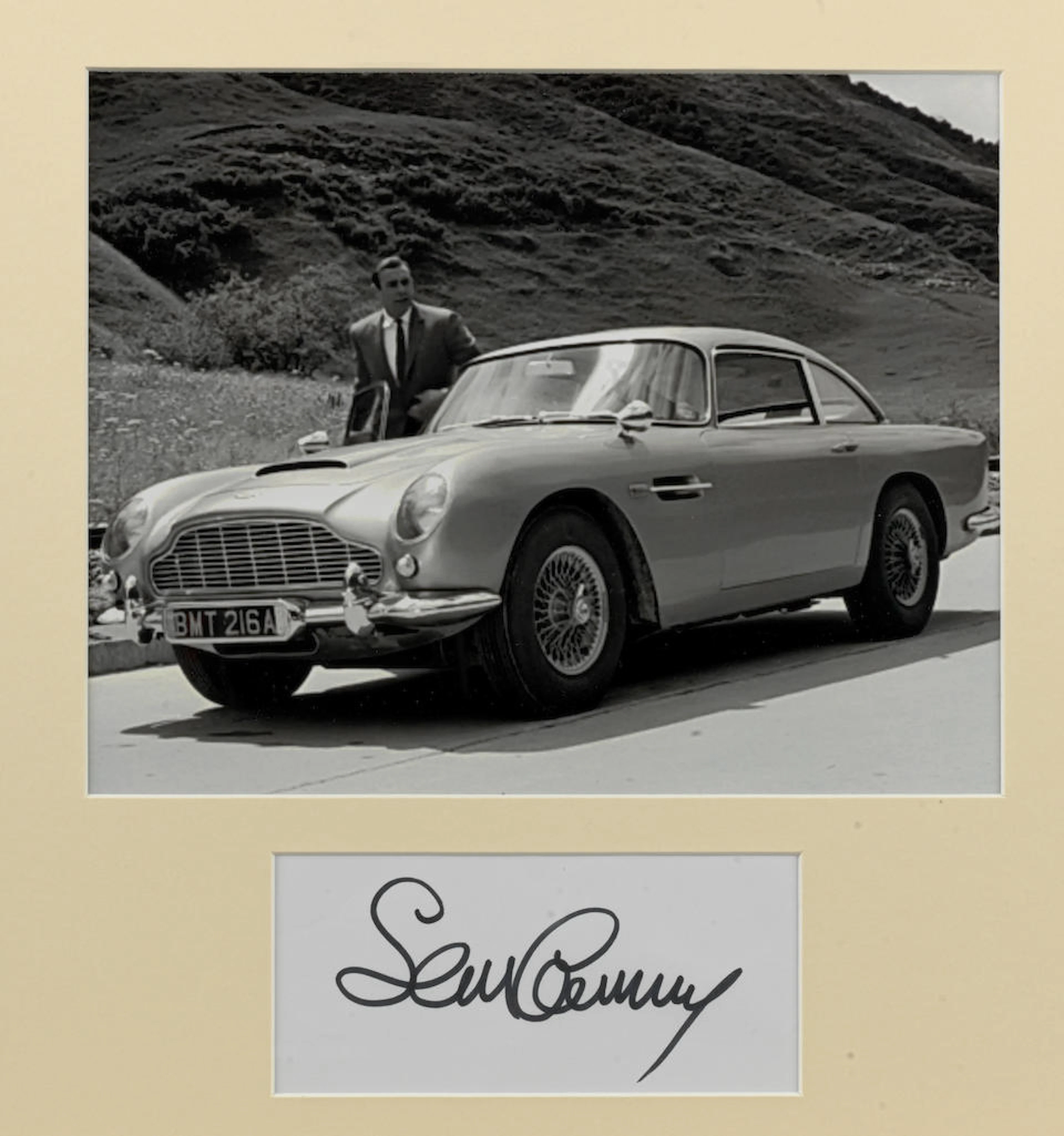 A photograph with signature, Sean Connery as 007 and Aston Martin DB5 BMT216A,