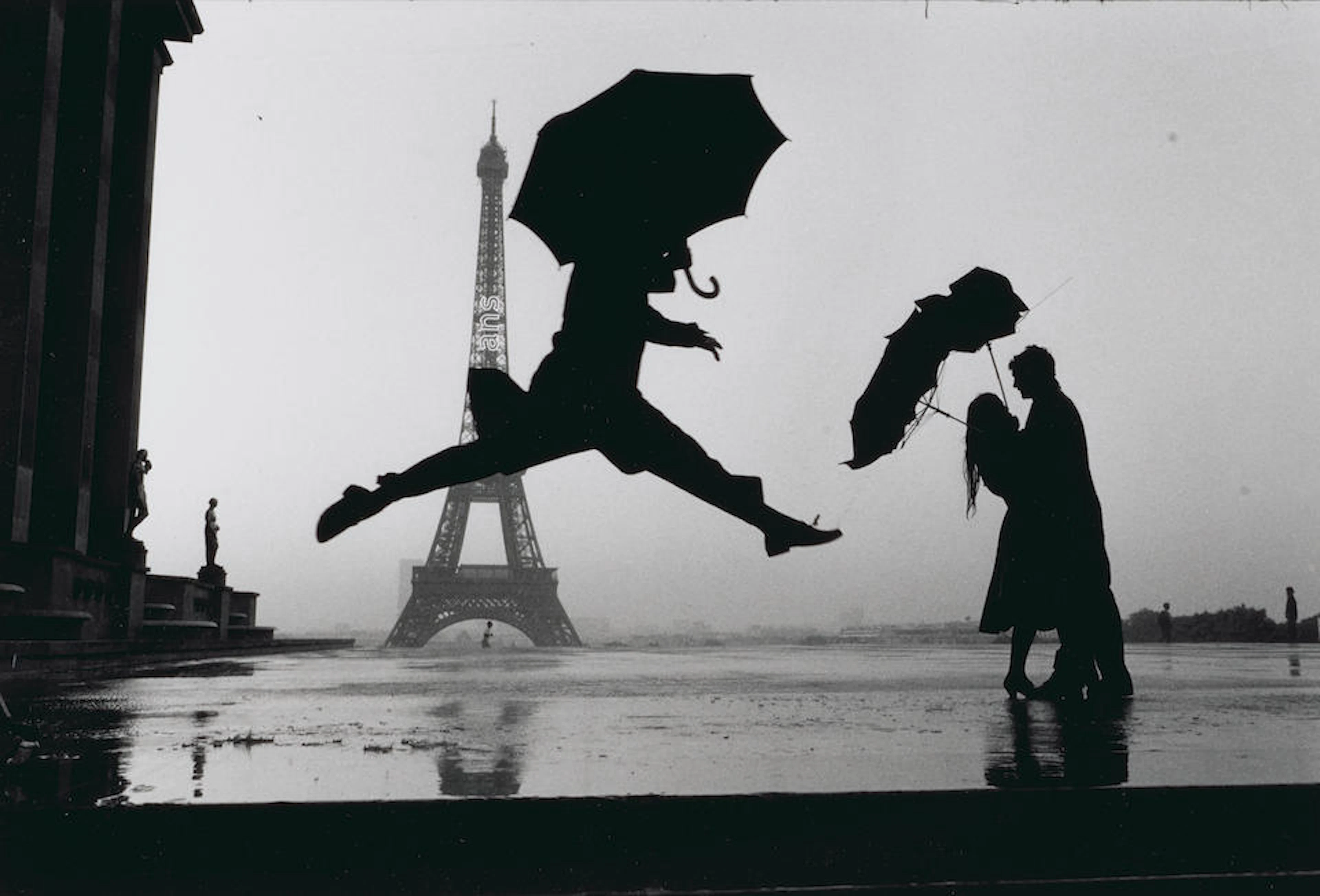 Elliott Erwitt (born 1928); Paris (Umbrella Jump);