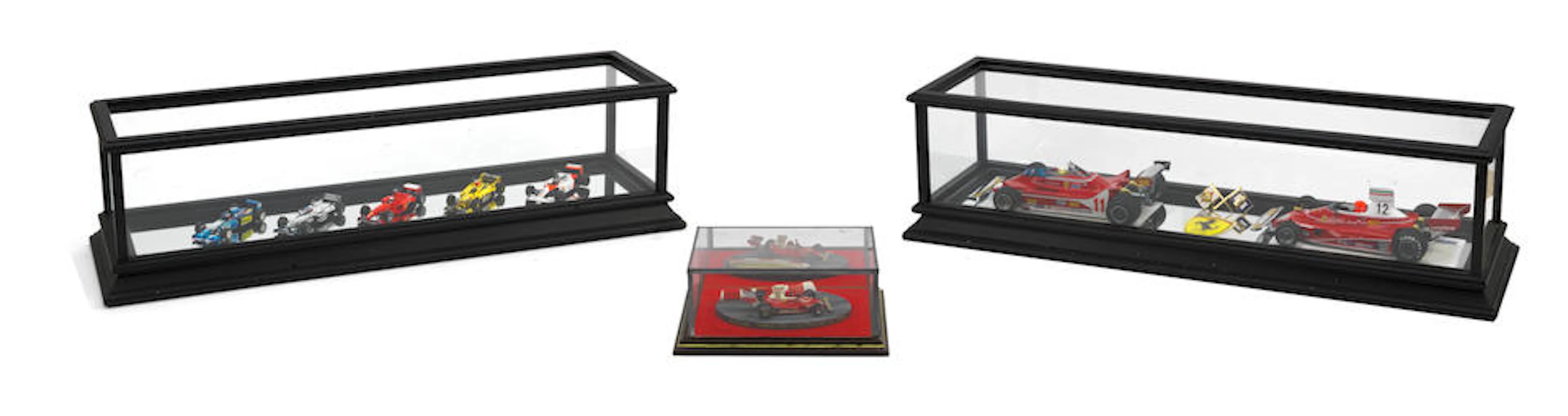 A cased display of two 1:18 scale Niki Lauda and Jody...