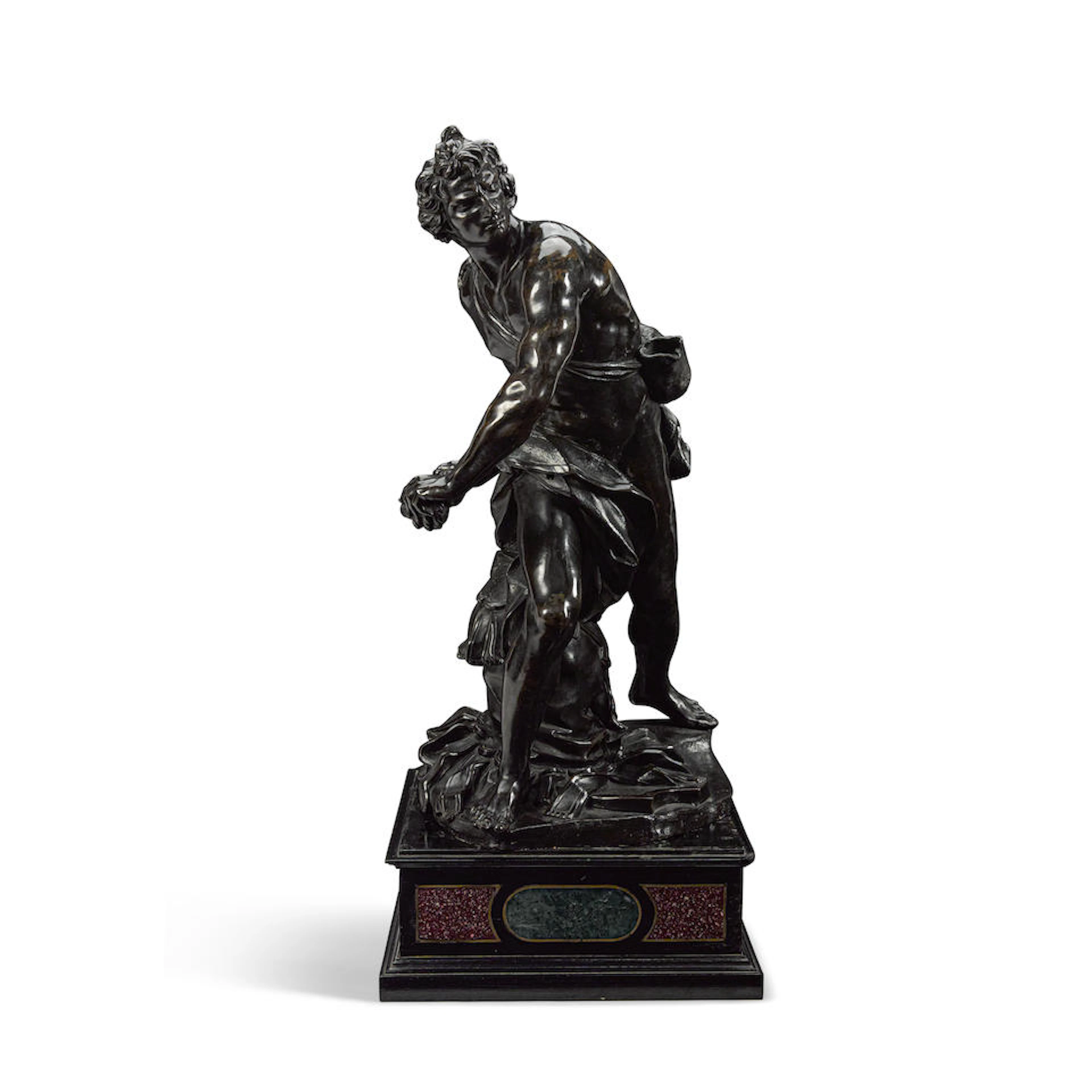 A FRENCH PATINATED BRONZE FIGURE: DAVID HOLDING HIS...