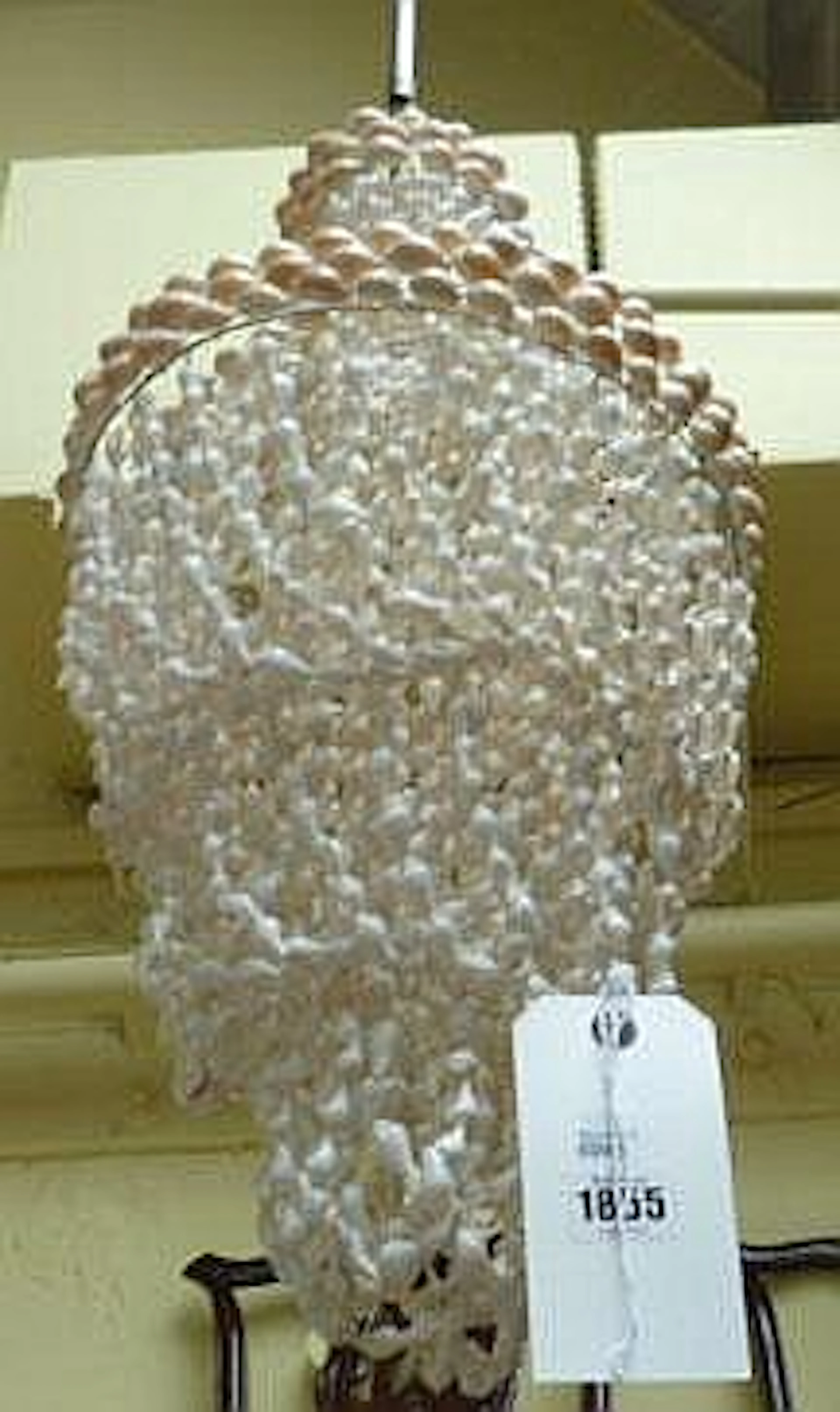 A modern three tier bag chandelier, hung and