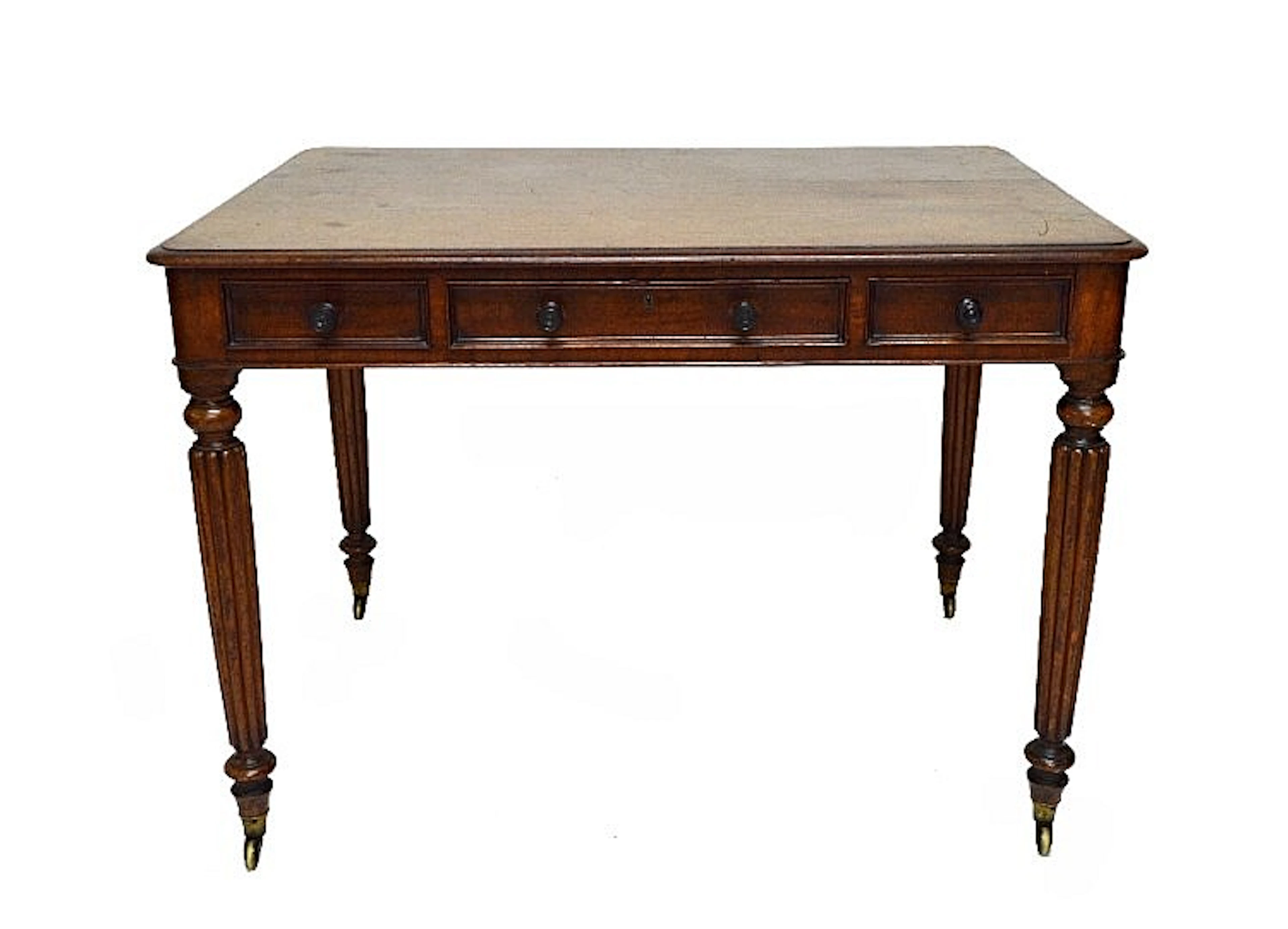 A George IV writing table with three frieze drawers and dummy verso, on tap