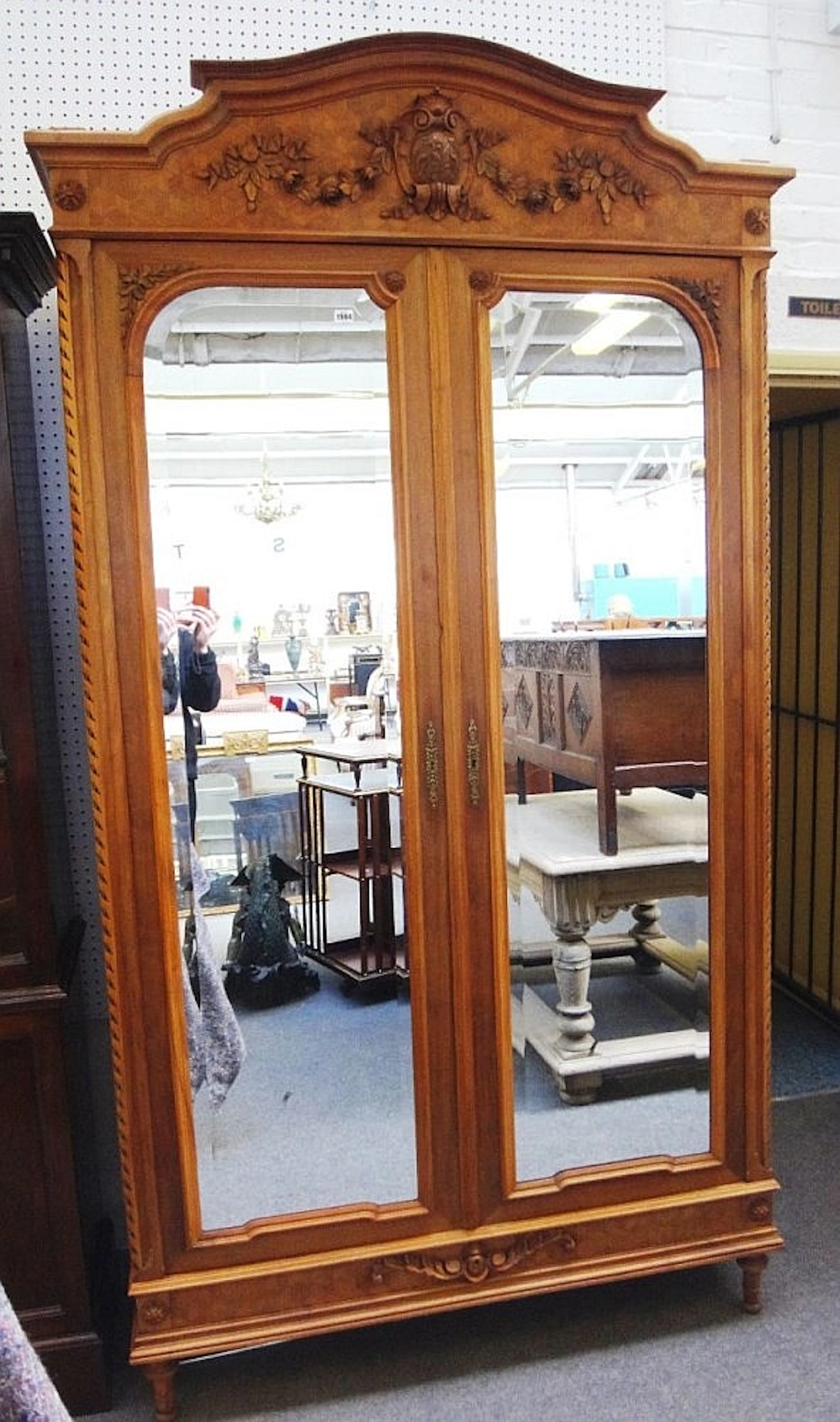 A 20th century French deceptive cube parquetry inlaid walnut wardrobe with