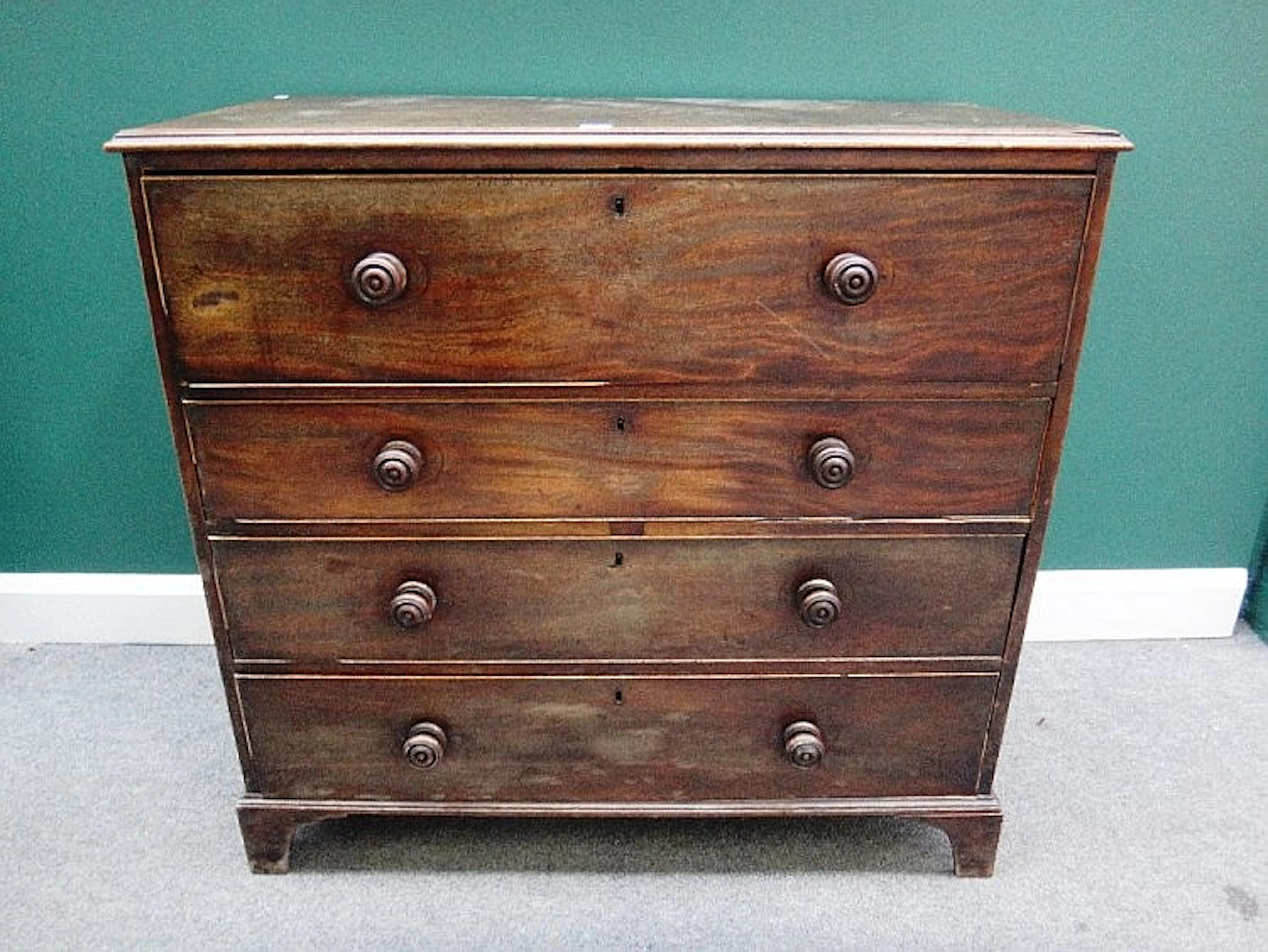 A George III mahogany secretaire chest, the fitted drawer over three long d