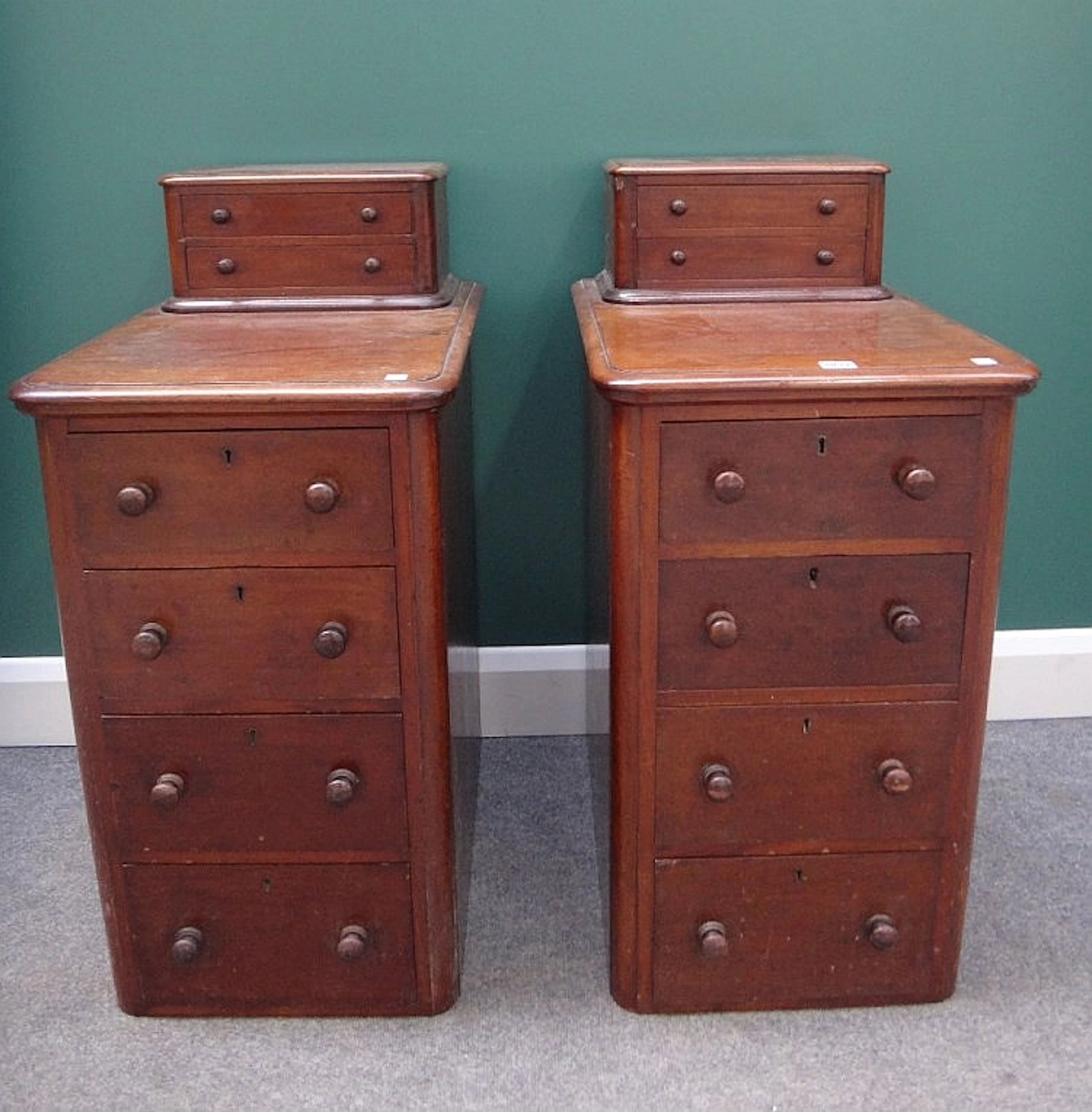 A pair of 19th century mahogany pedestals, each with two short drawers over