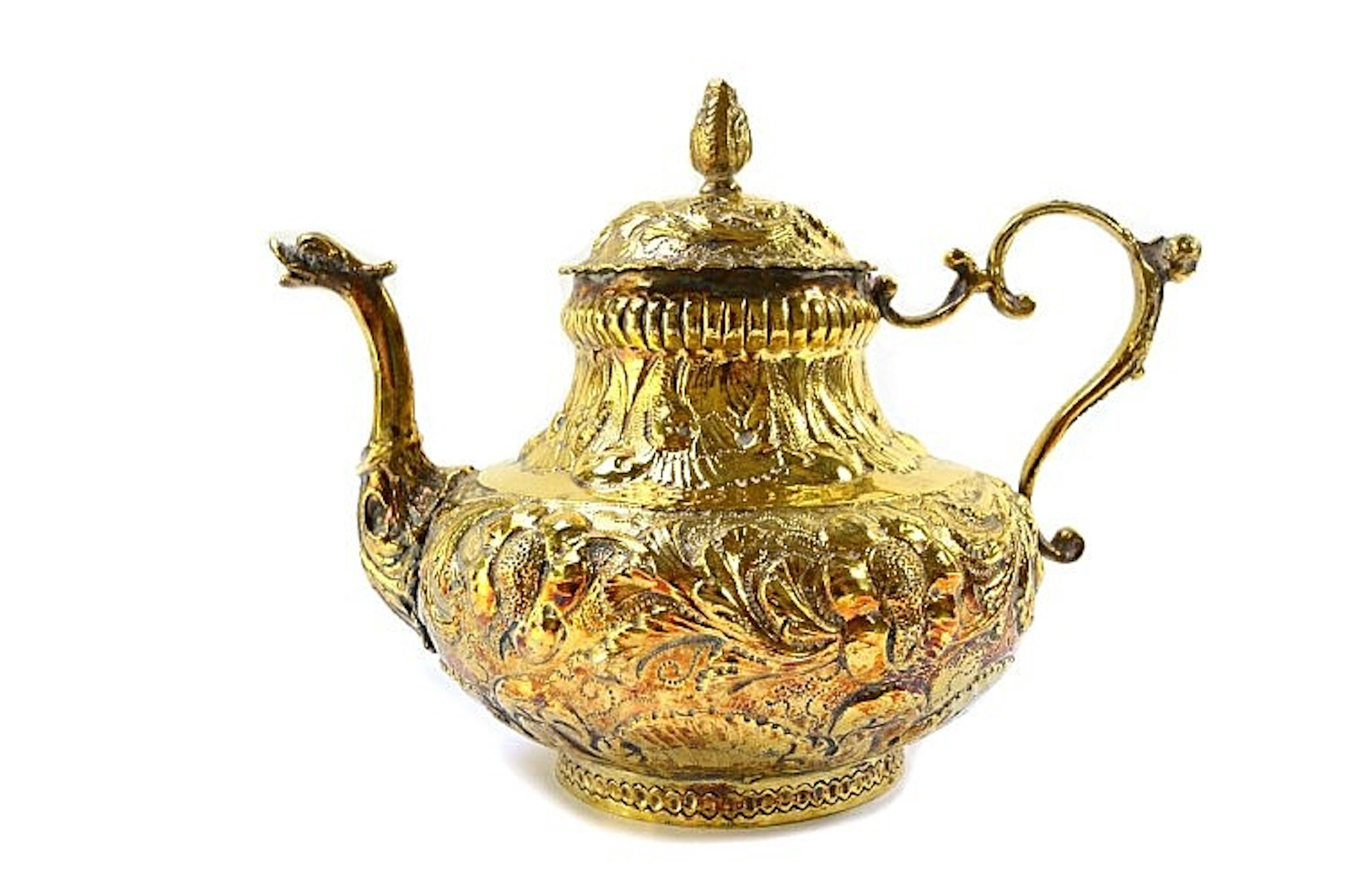 A European silver gilt teapot, of baluster form, the body with floral and f