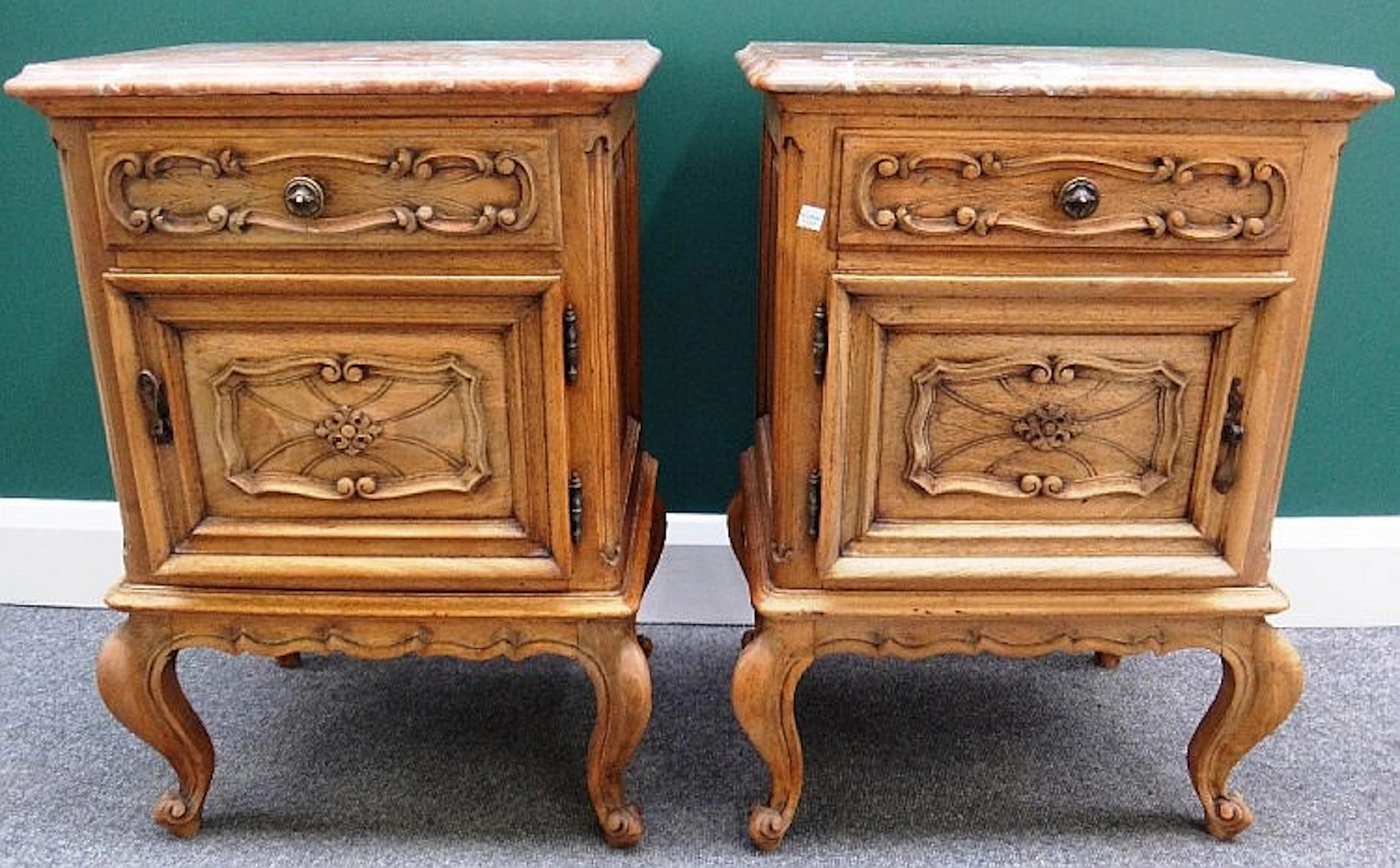 A pair of 20th century bedside tables, each with marble top over a bleached