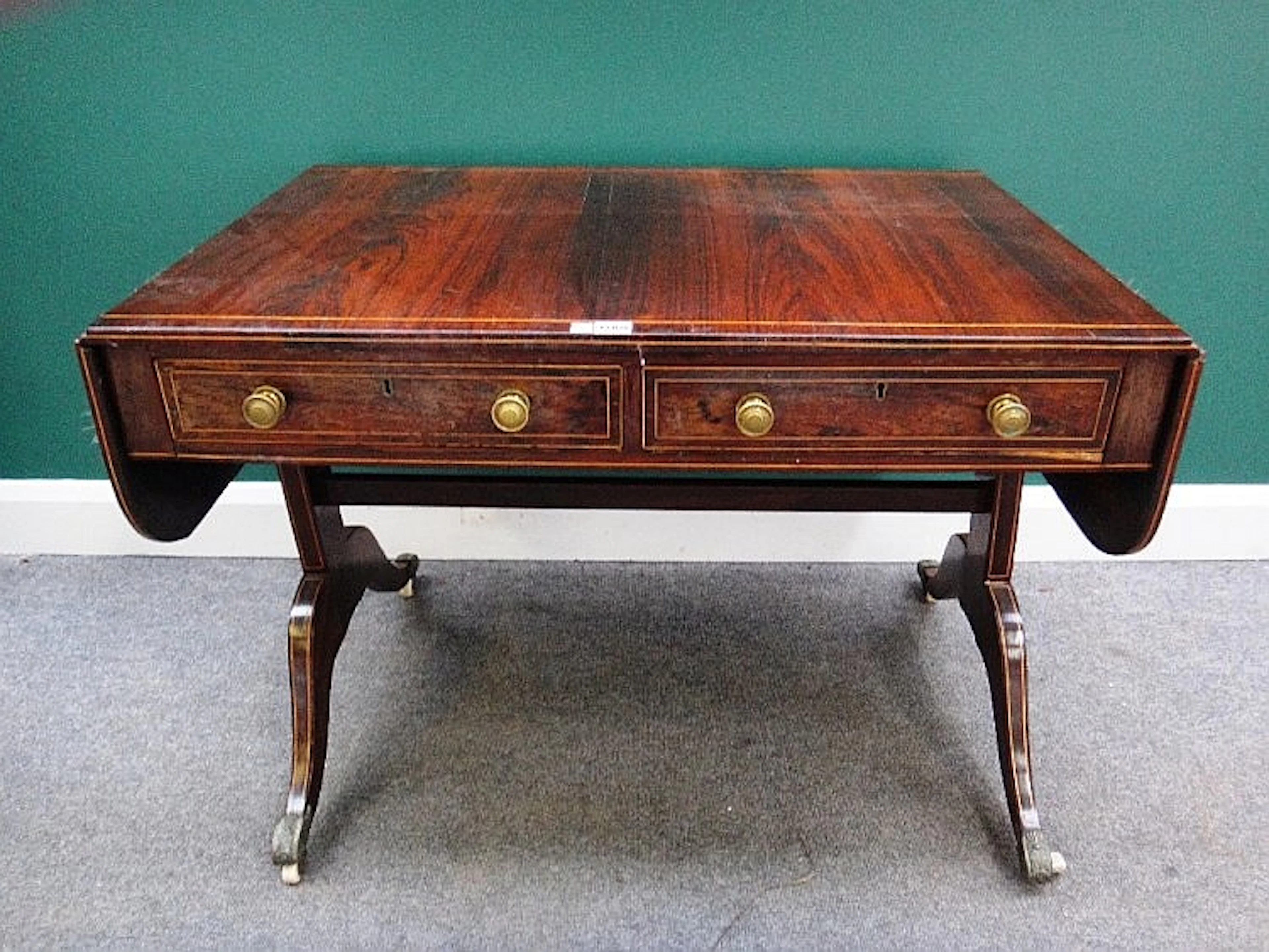 A George III inlaid rosewood sofa table, with a pair of frieze drawers and