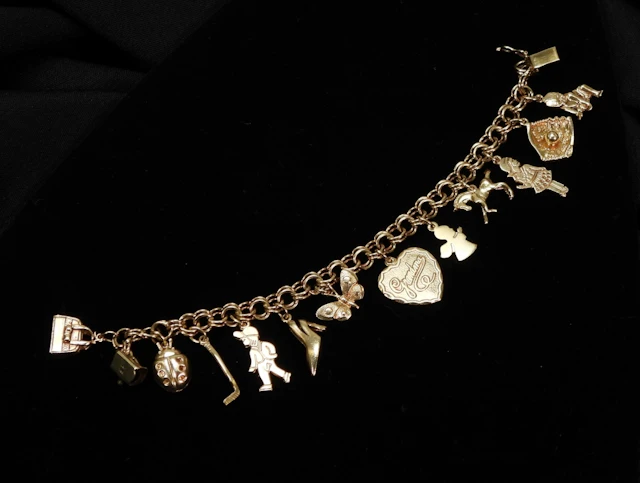 Lady's 14K Gold Charm Bracelet 42.1g