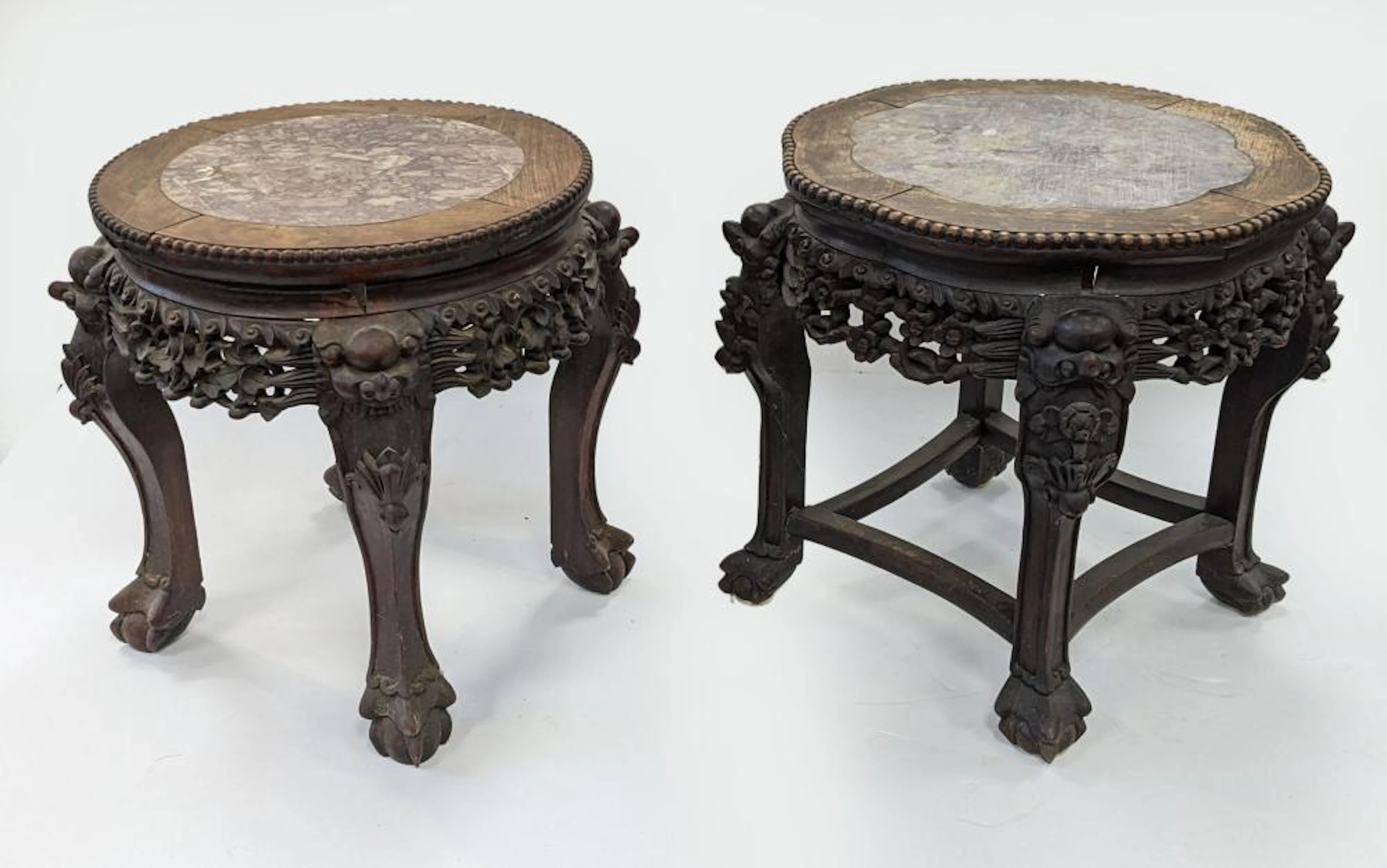 2 Chinese carved hardwood tables. Marble inset tops.