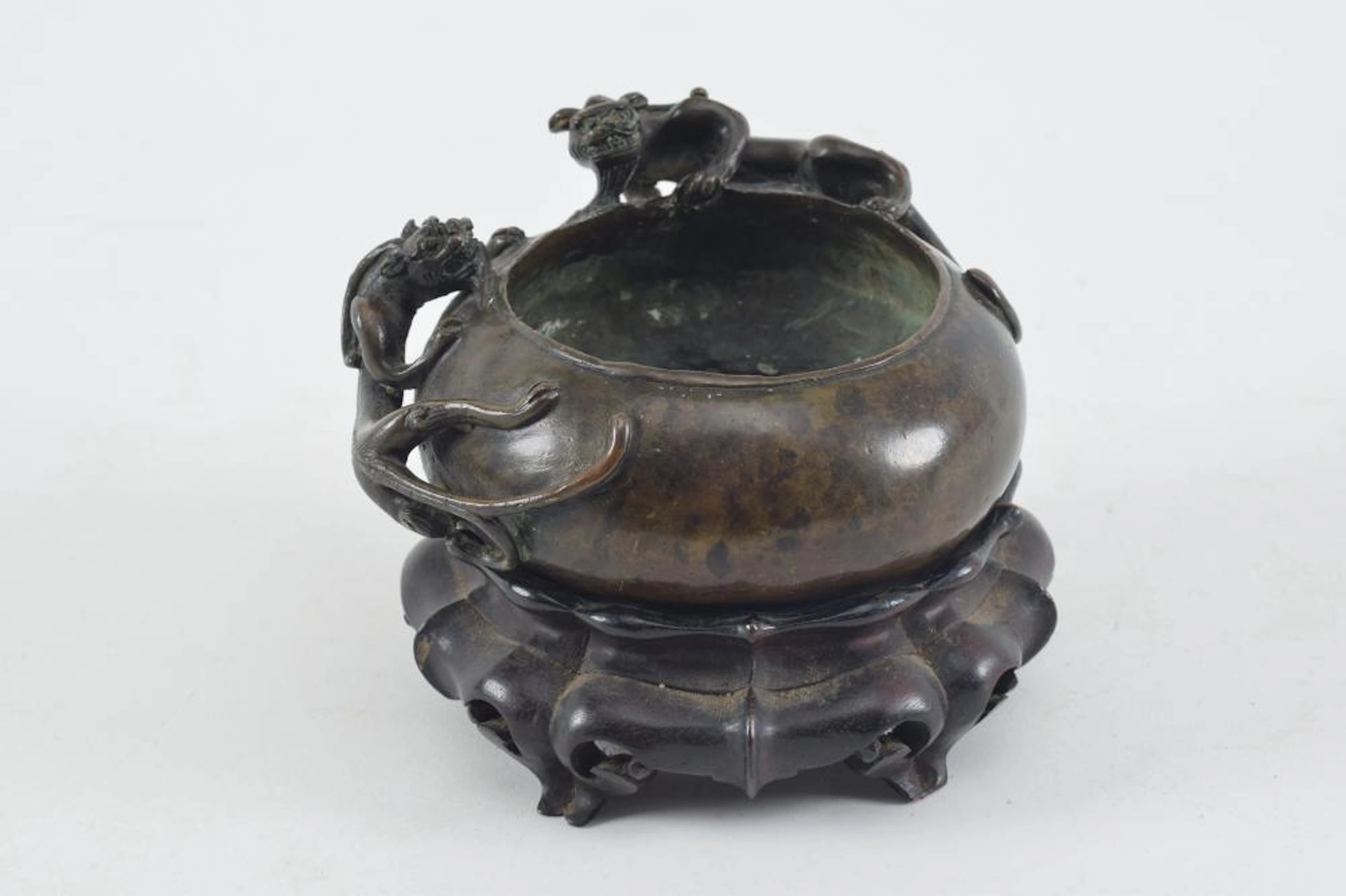 Bronze water coupe. China. 19th century. Decoration of 2 chih lung. 4.75in wide.