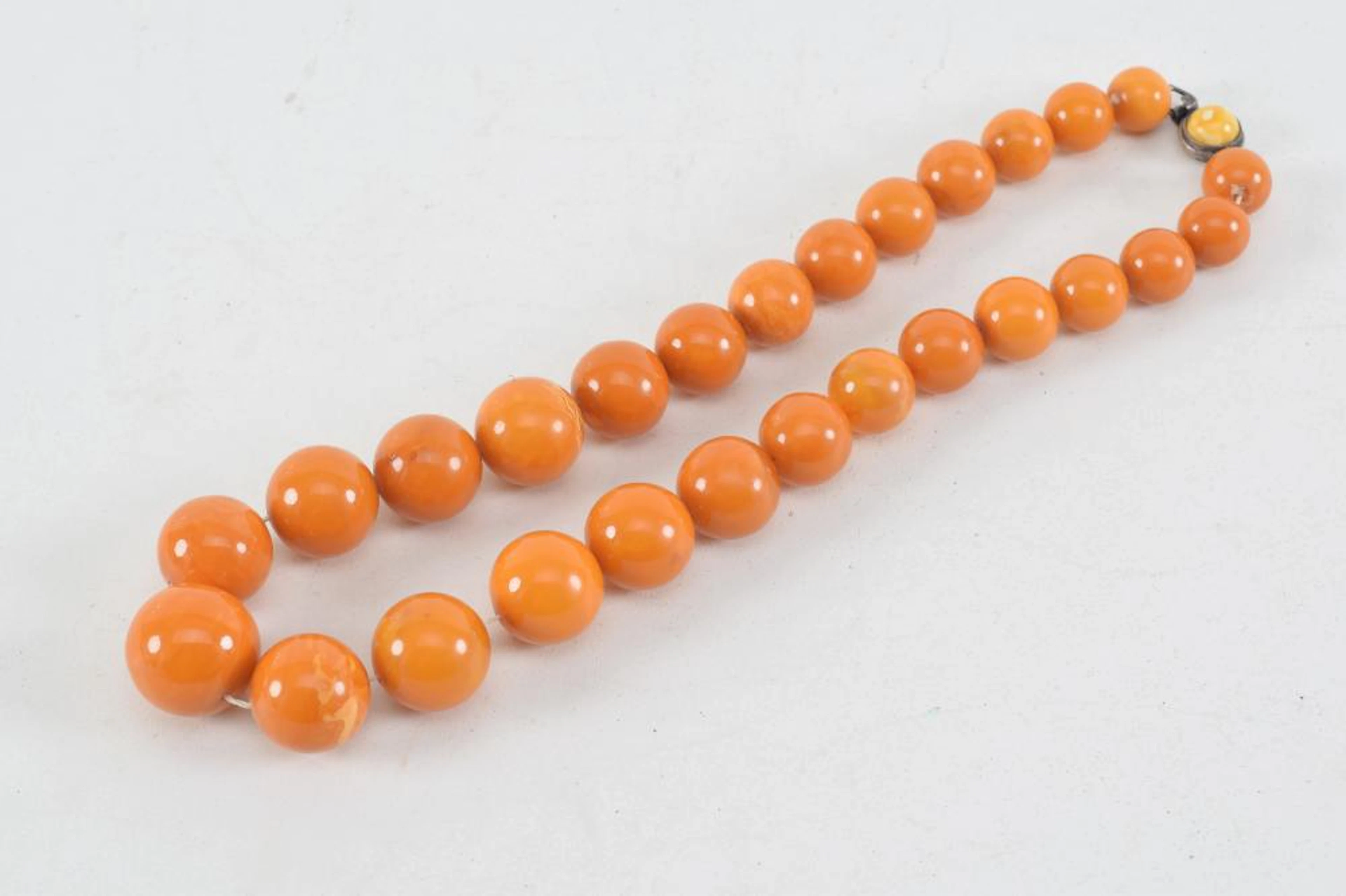 Set of butterscotch amber graduated beads. 18.5in length.