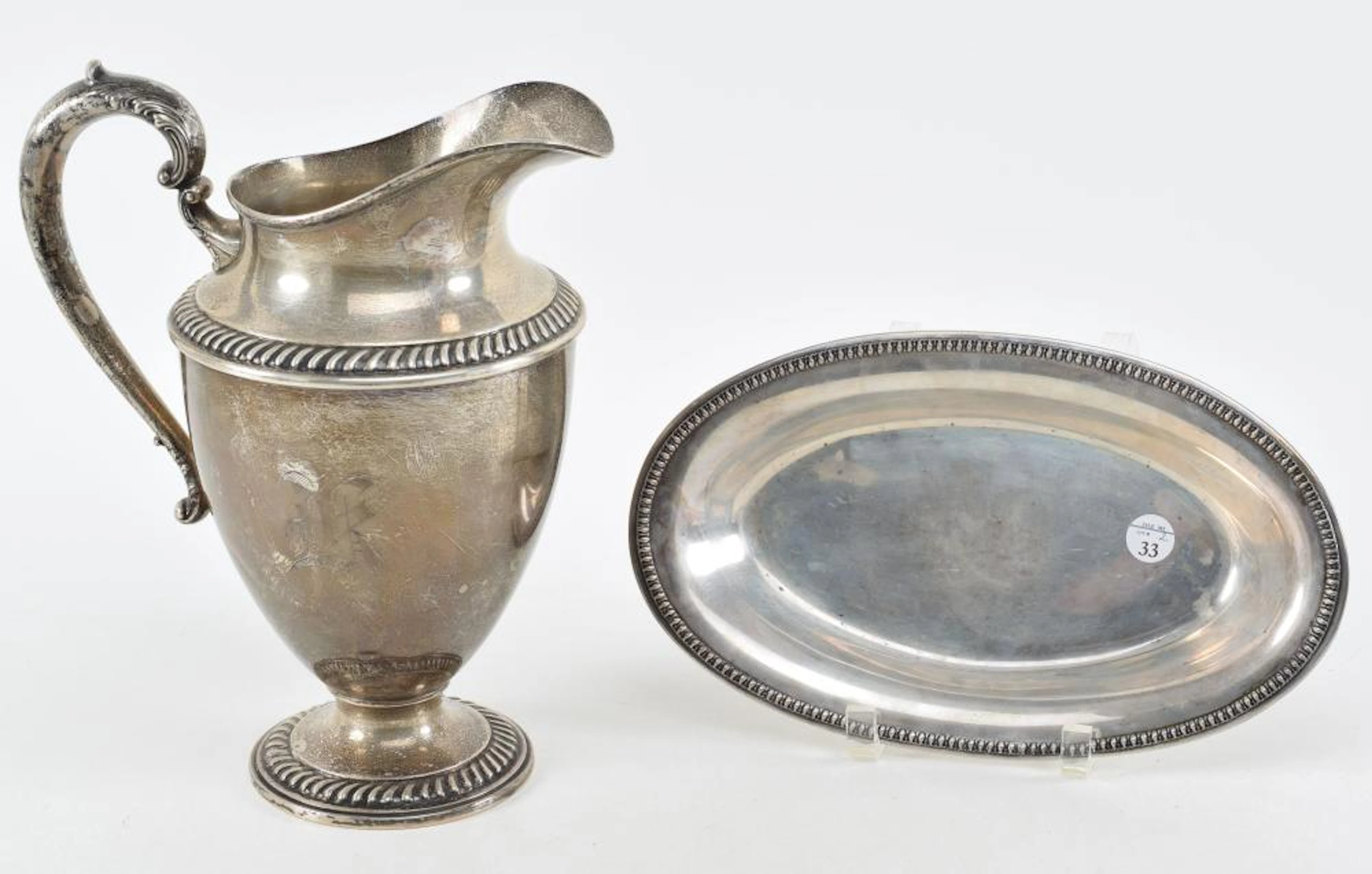 Sterling silver water pitcher and bread tray
