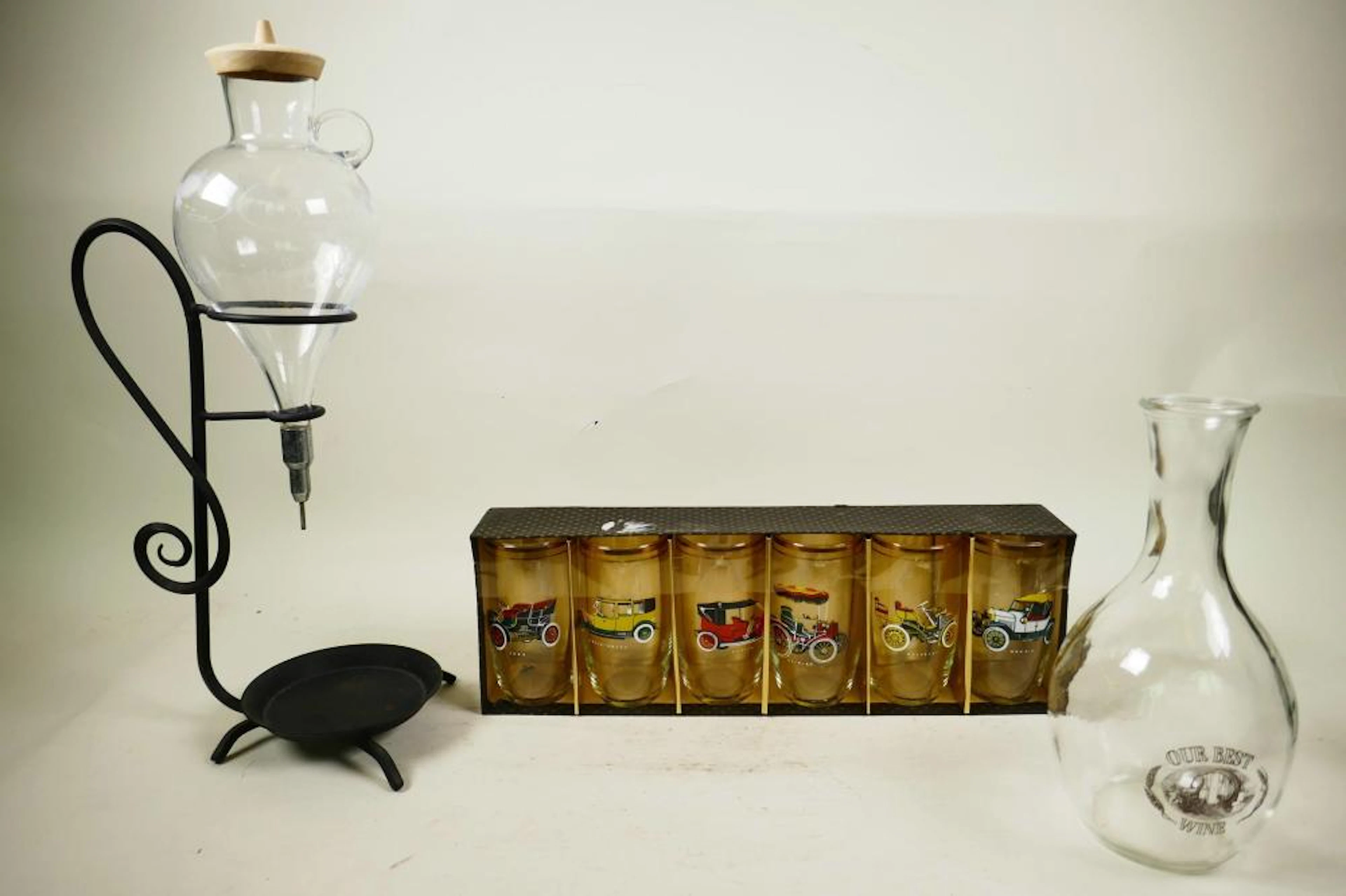 A set of six boxed 1960s classic car tumblers with gilt borders
