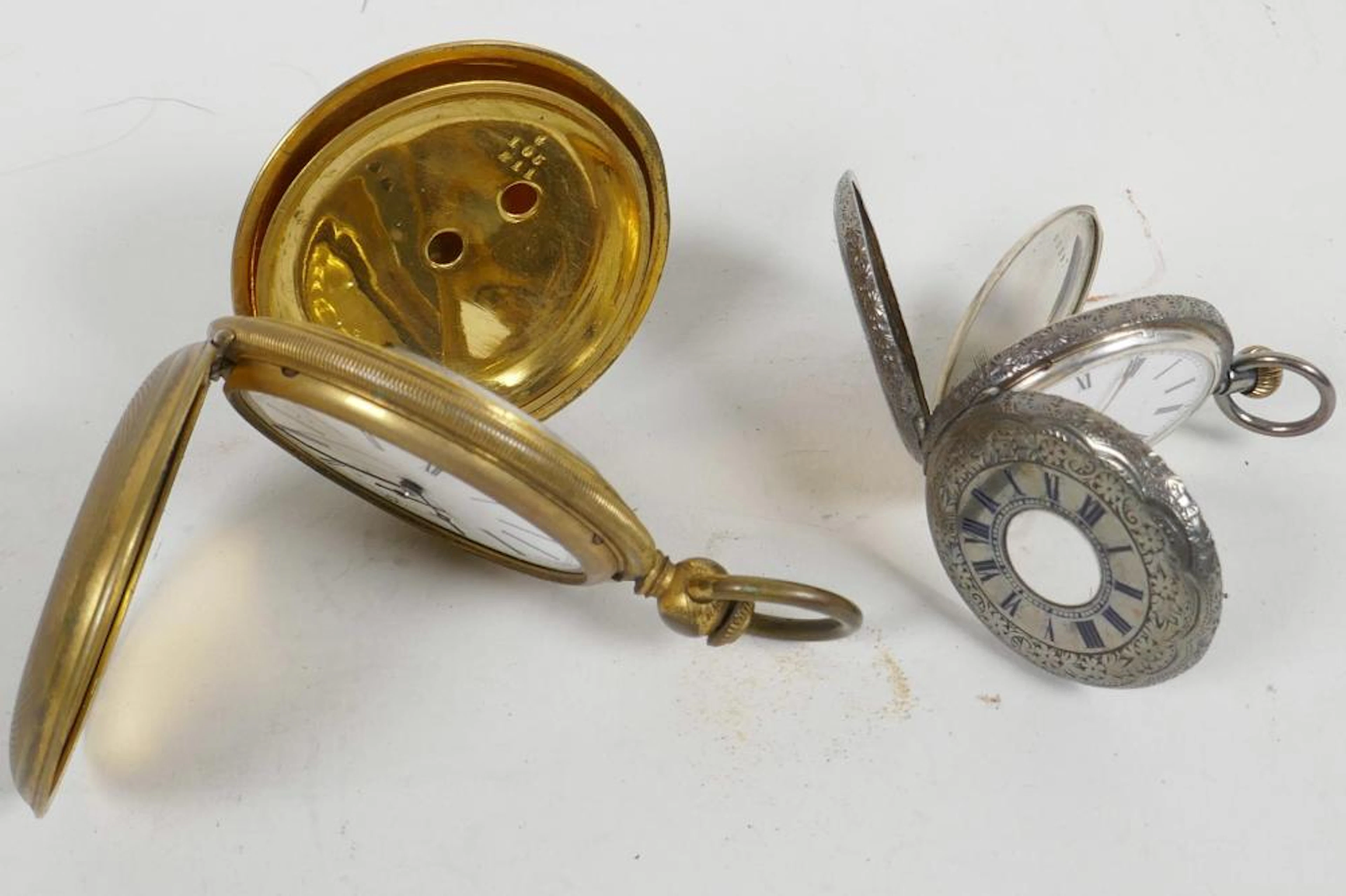 A lady's engraved silver half hunter pocket watch with white enamel dial