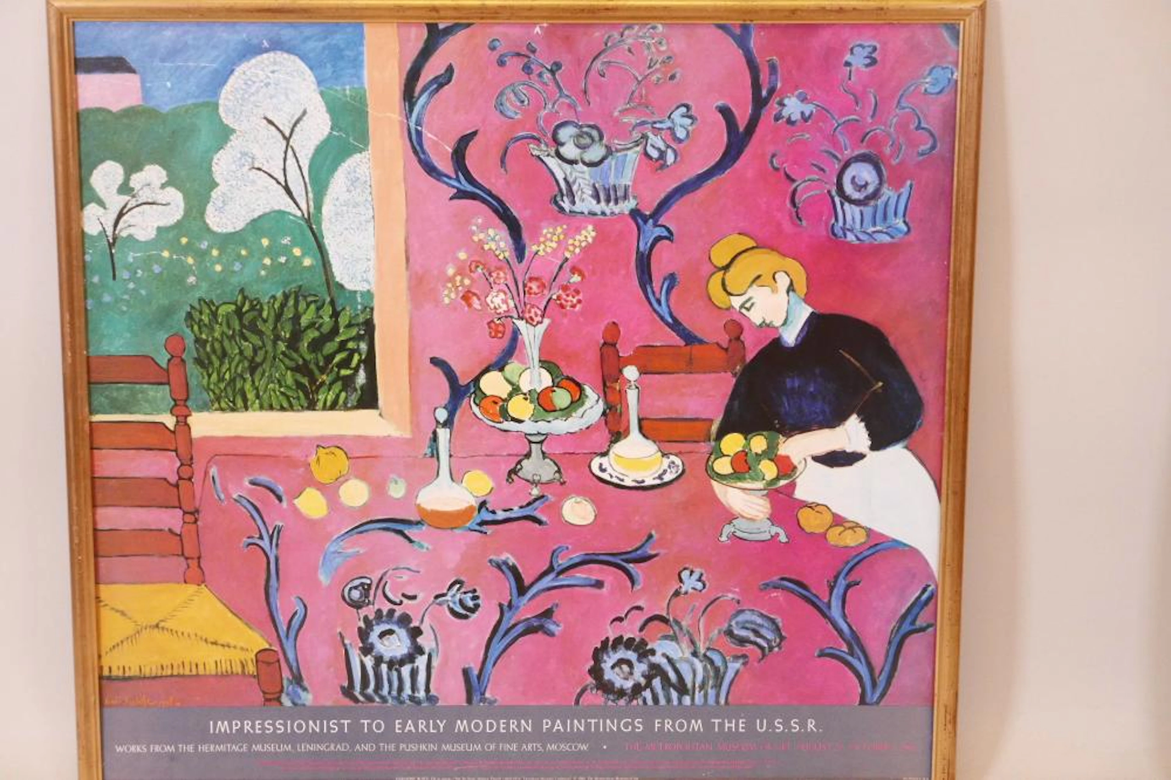 A framed advertising poster for the Metropolitan Museum...