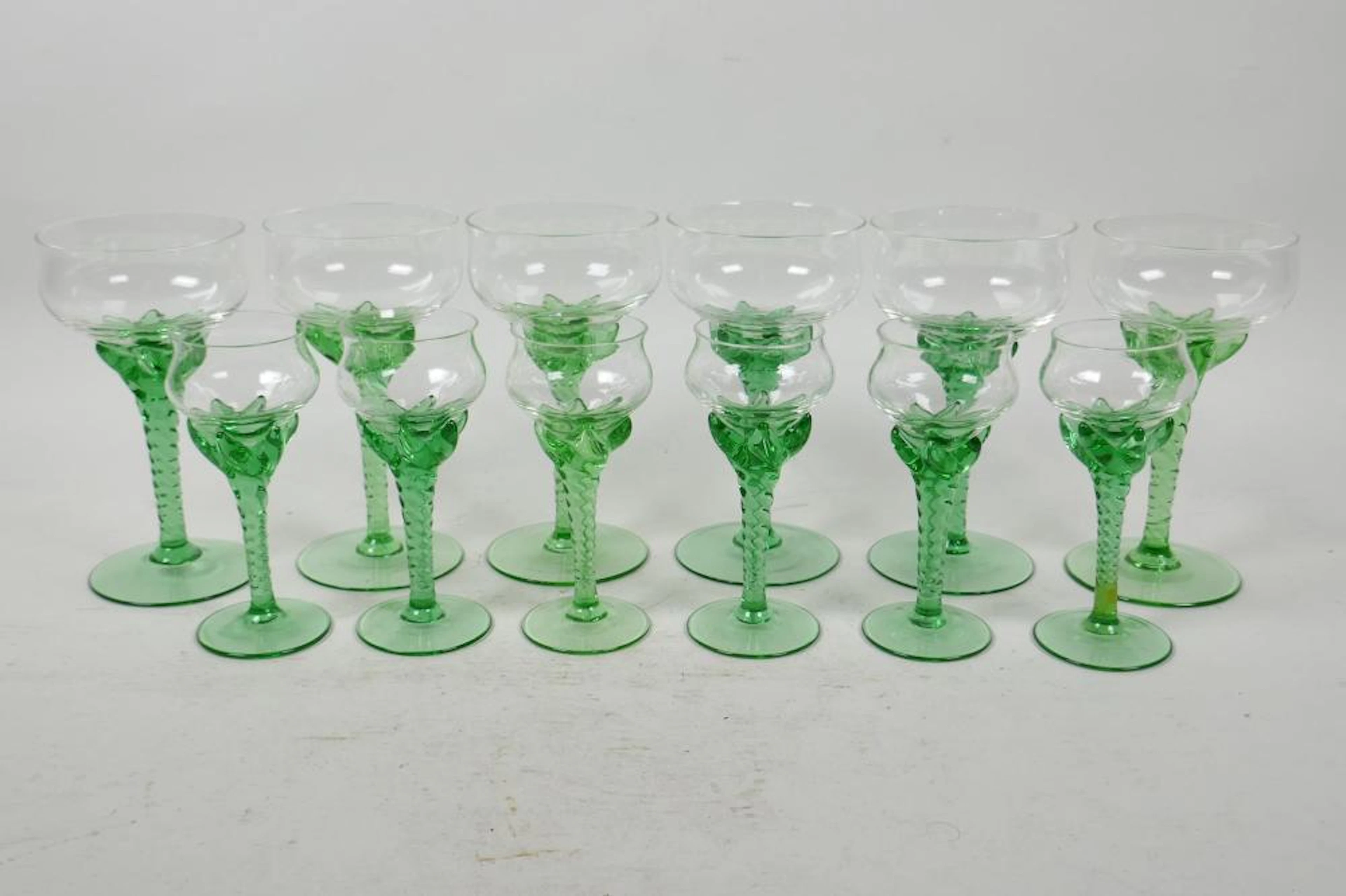 A set of six and six uranium wine and licquor glasses with spiral stems