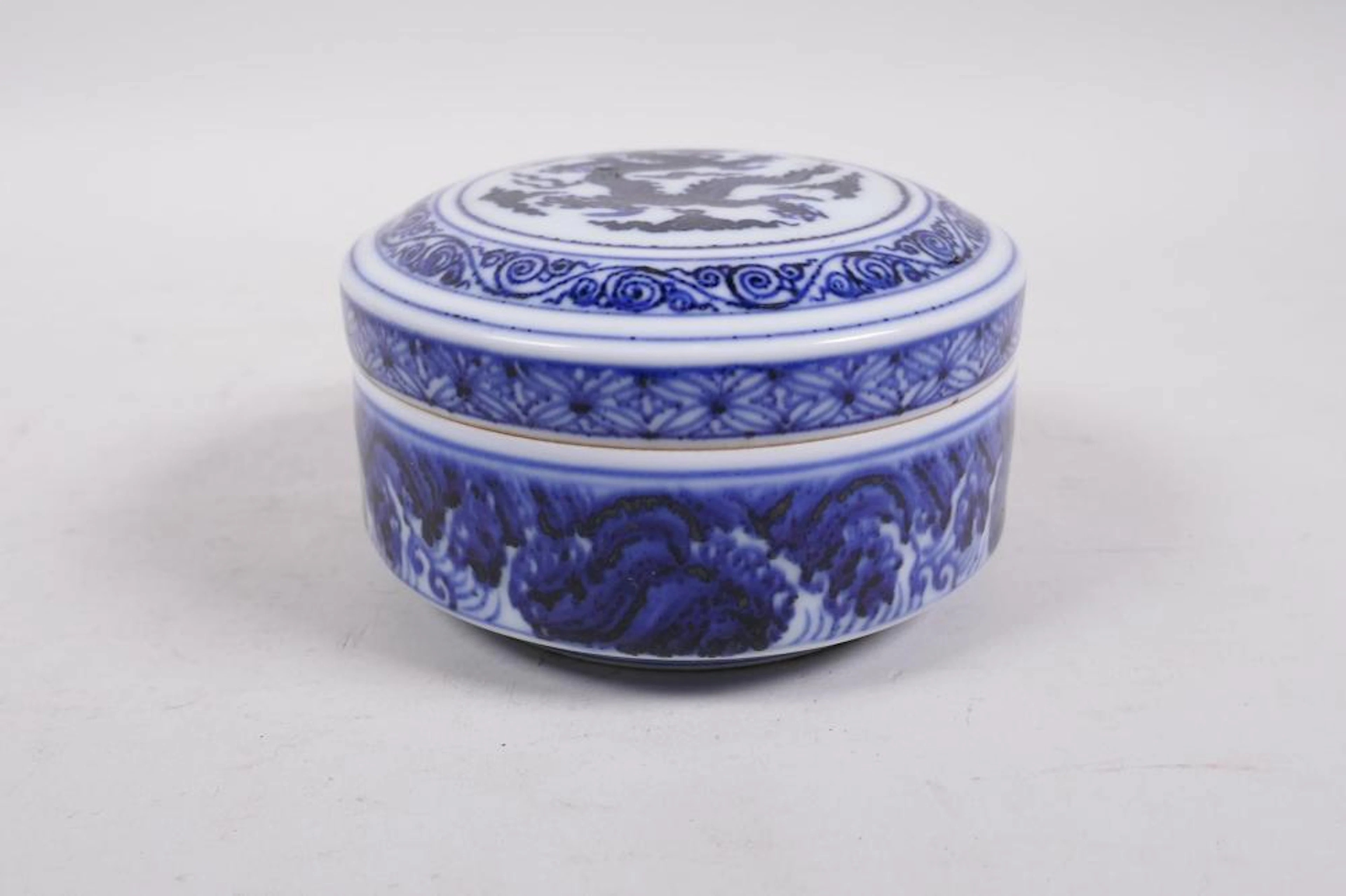 A Ming style blue and white porcelain cylinder box and...